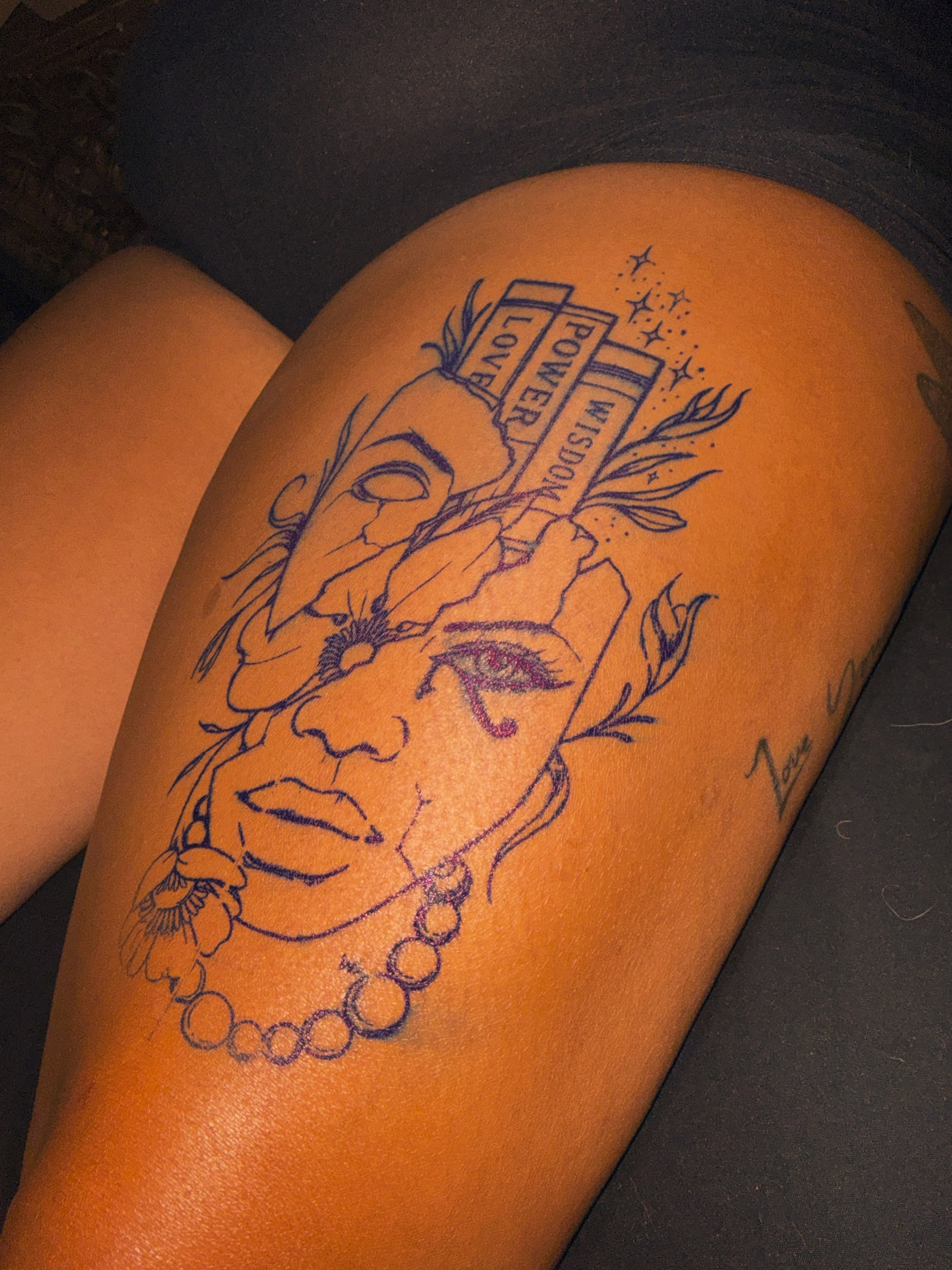 Woman's face fine line tattoo on the thigh by Tatz By Benji