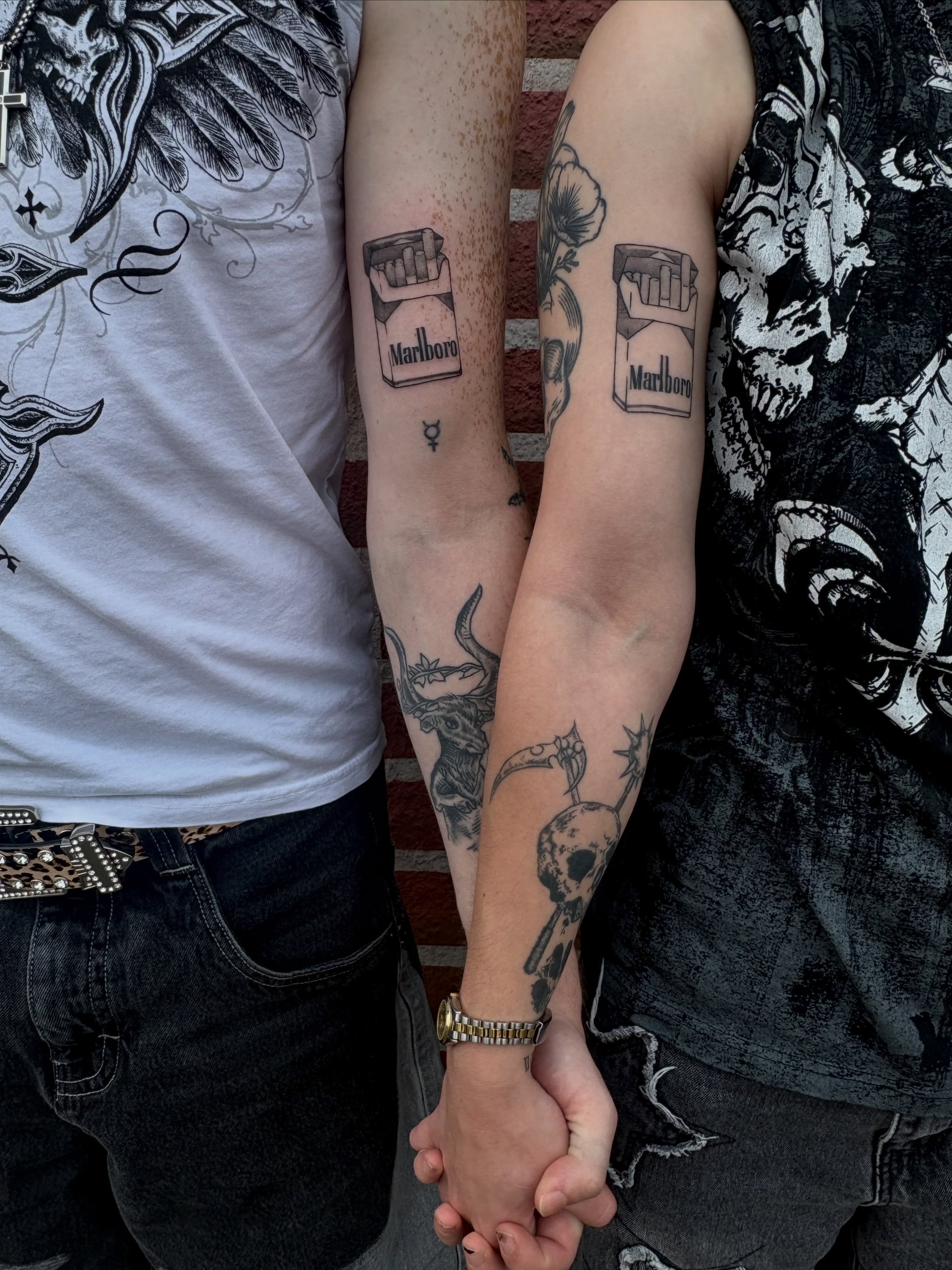 Marlboro cigarette pack black and grey tattoo on the forearm by izzy solae