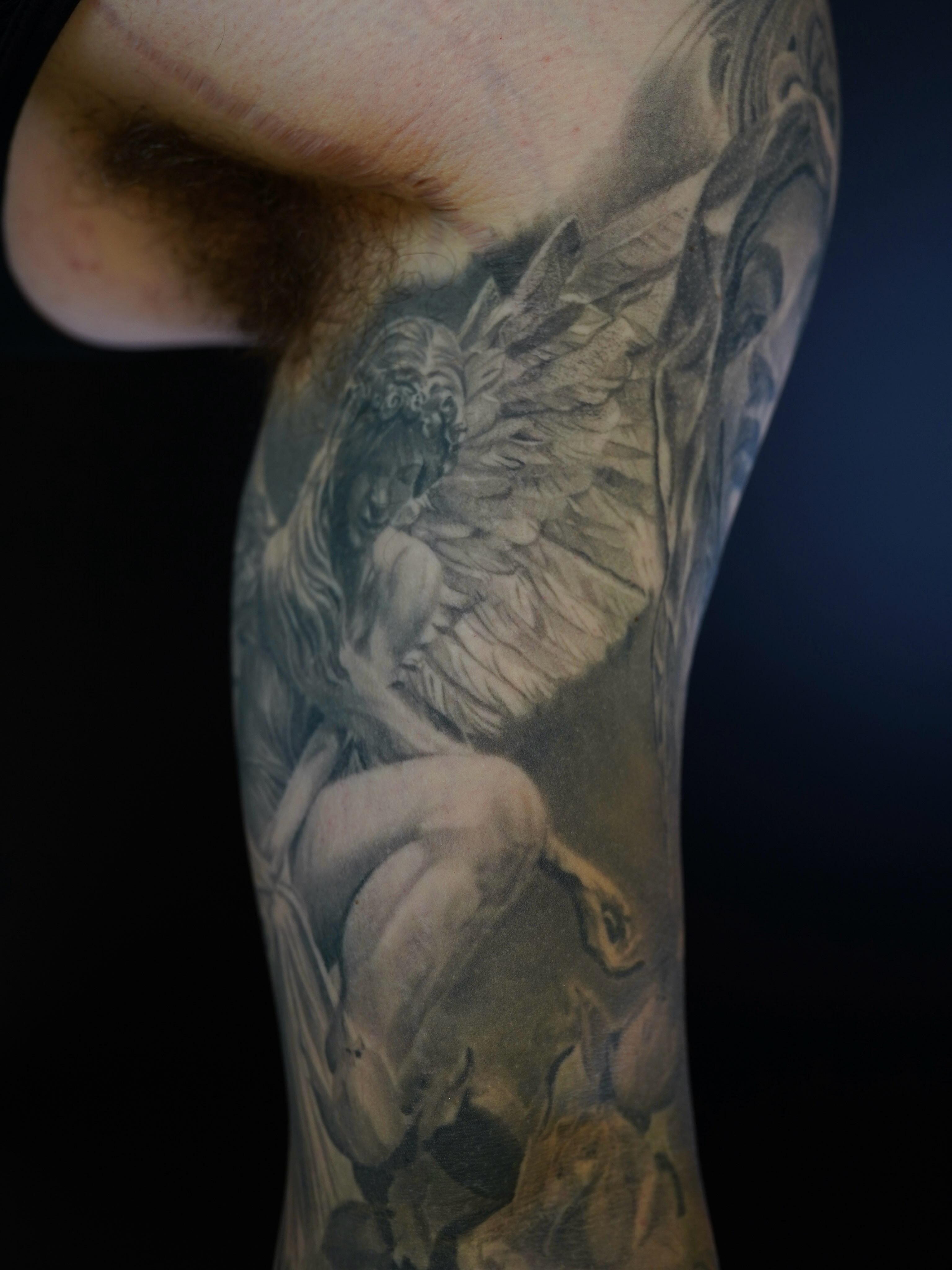 Angel realism tattoo on the forearm by Eric RudeInk