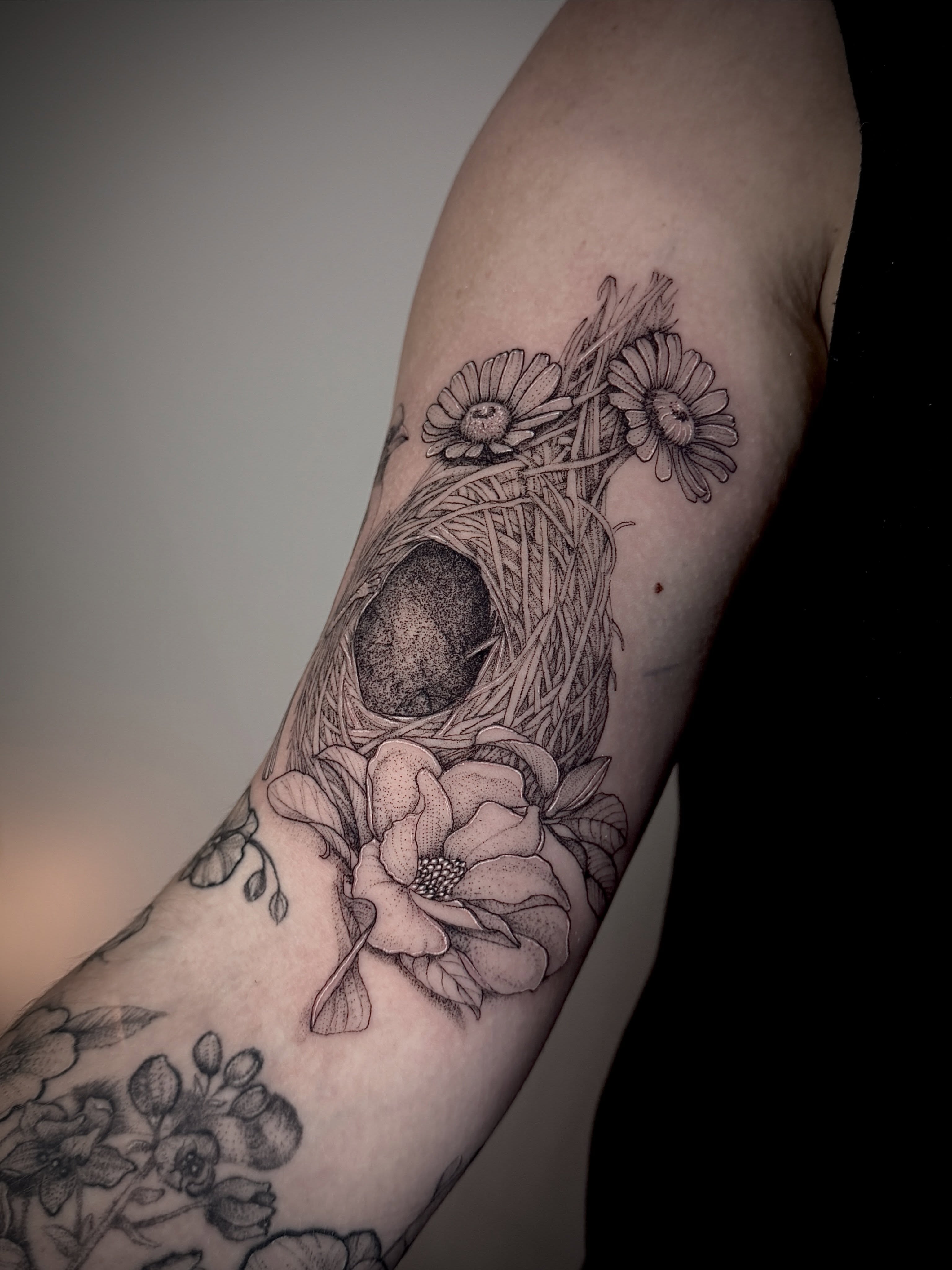 Nest and flowers realism tattoo on the forearm by Tattoos by Robyn Pallotta, Austin, Texas