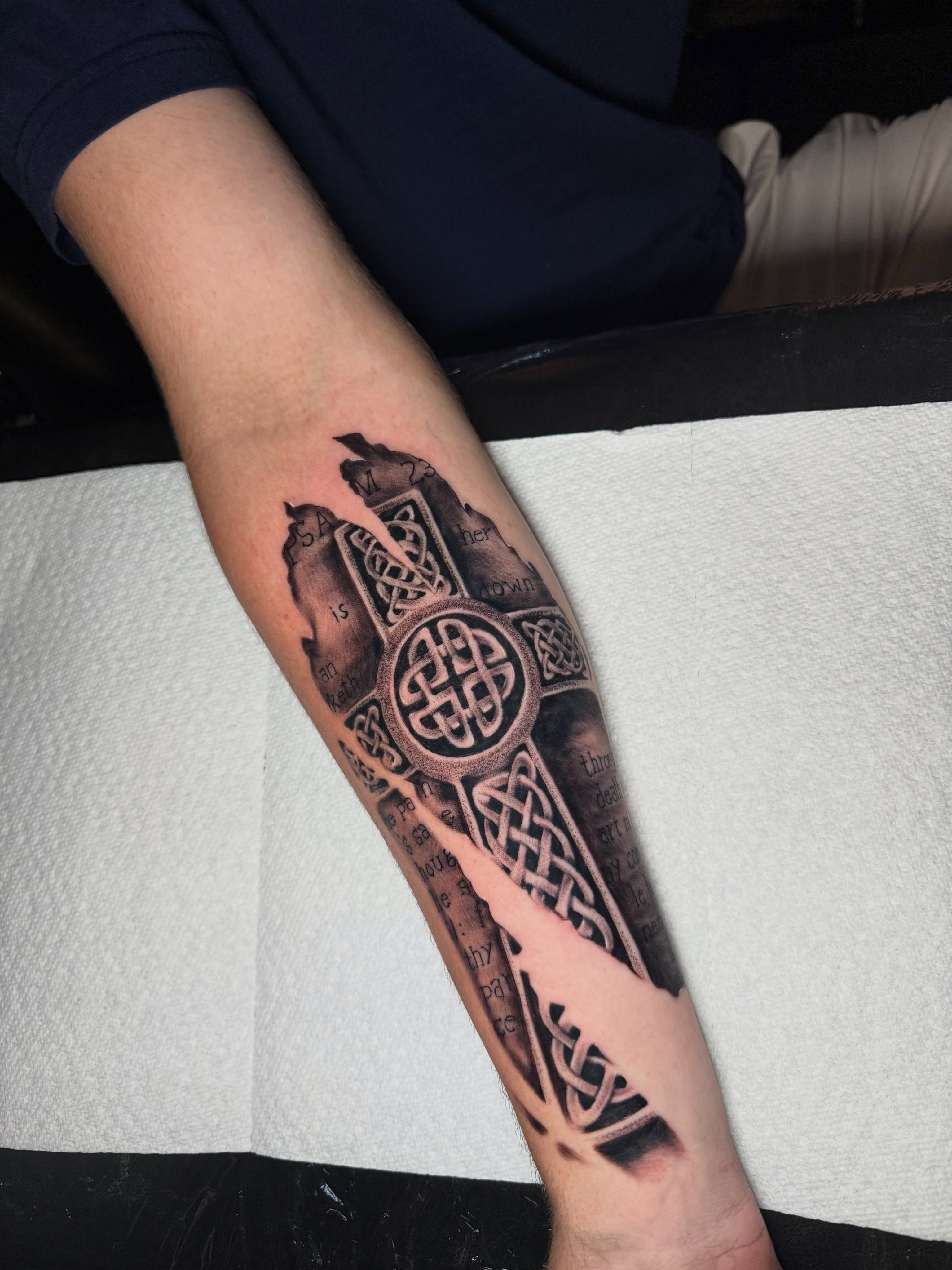 Cross with Celtic knots geometric tattoo on the forearm by Steve - Tattoo Artist