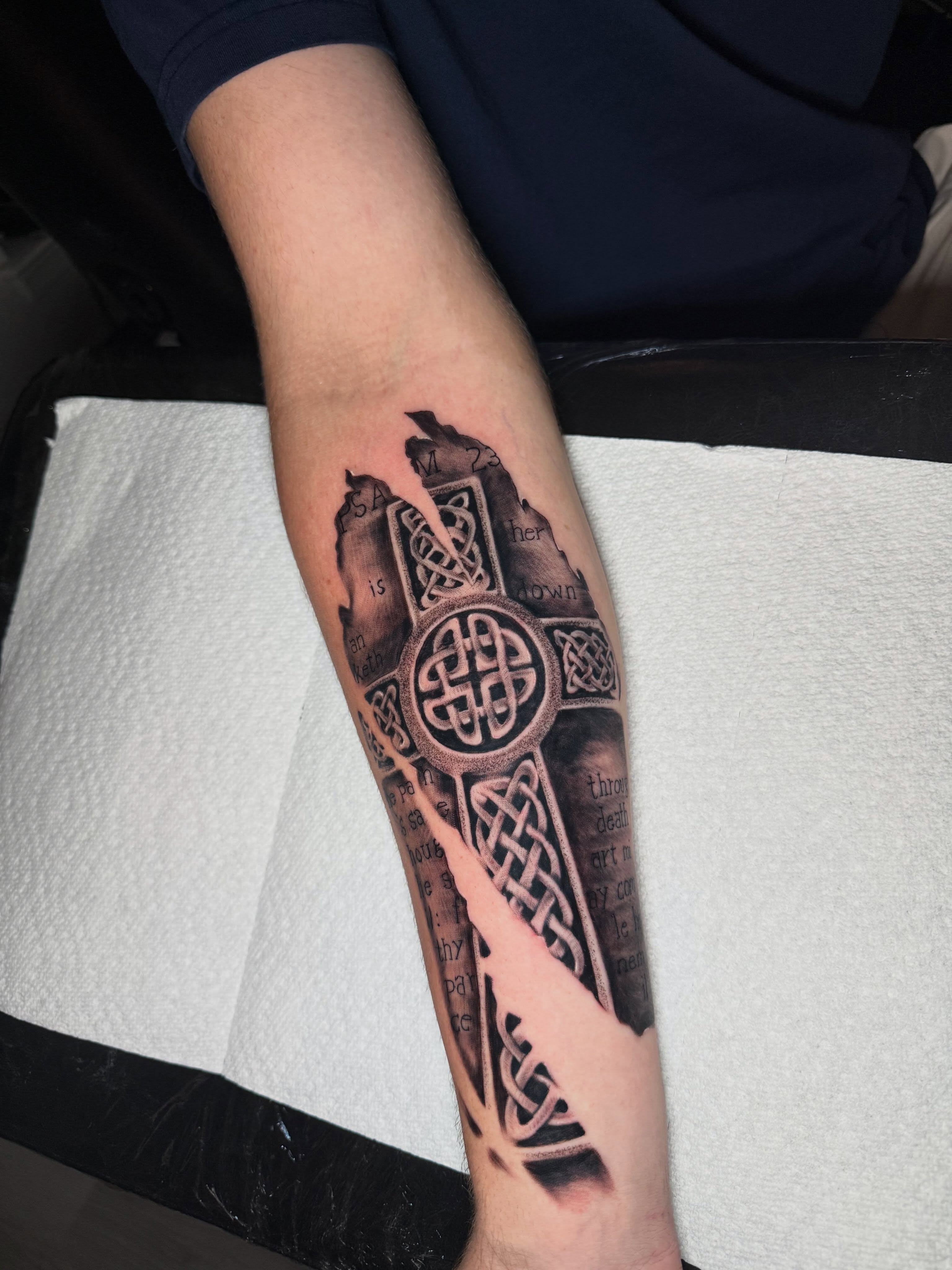 Cross with Celtic knots geometric tattoo on the forearm by Steve - Tattoo Artist
