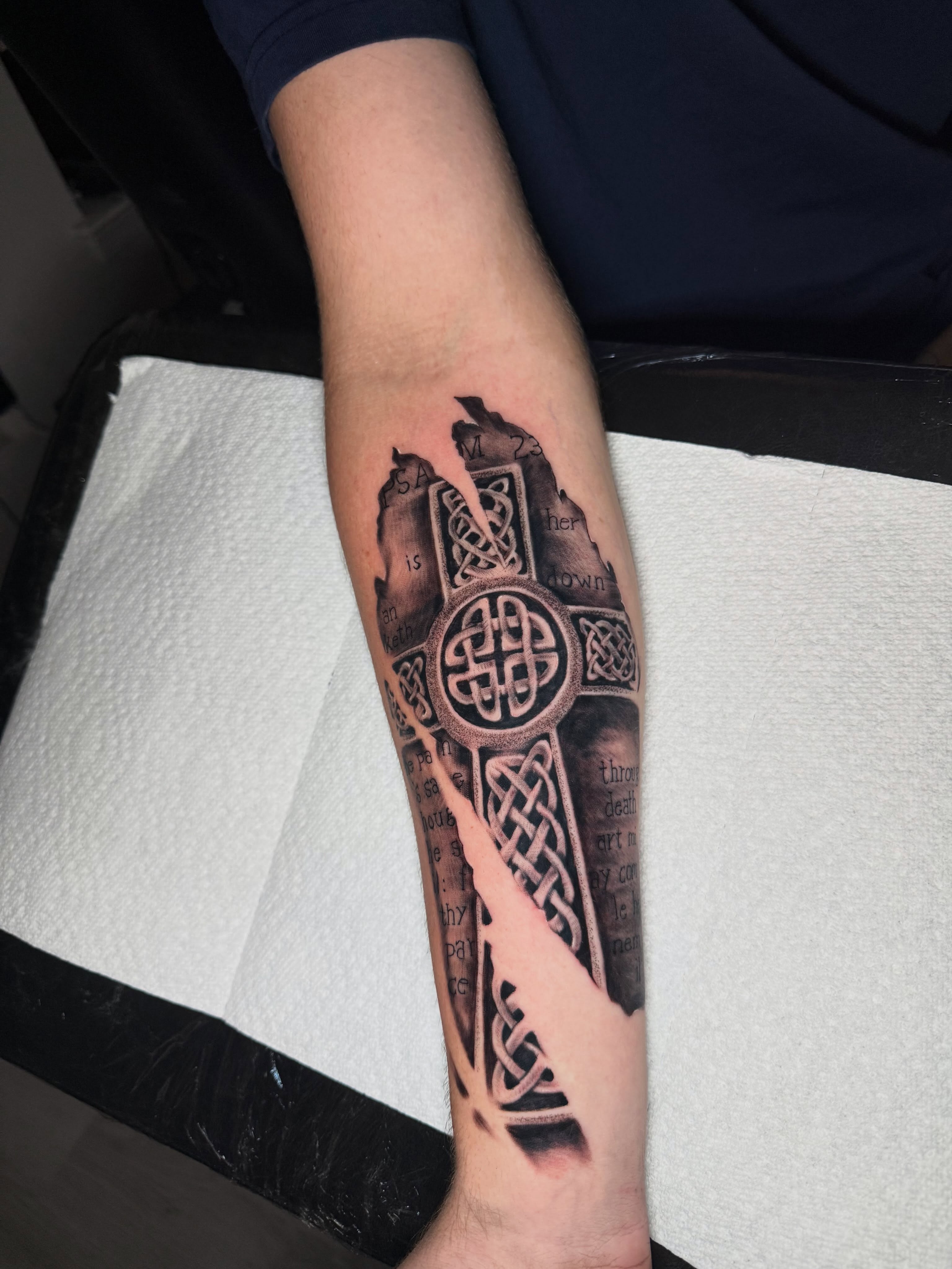 Cross with Celtic knots geometric tattoo on the forearm by Steve - Tattoo Artist