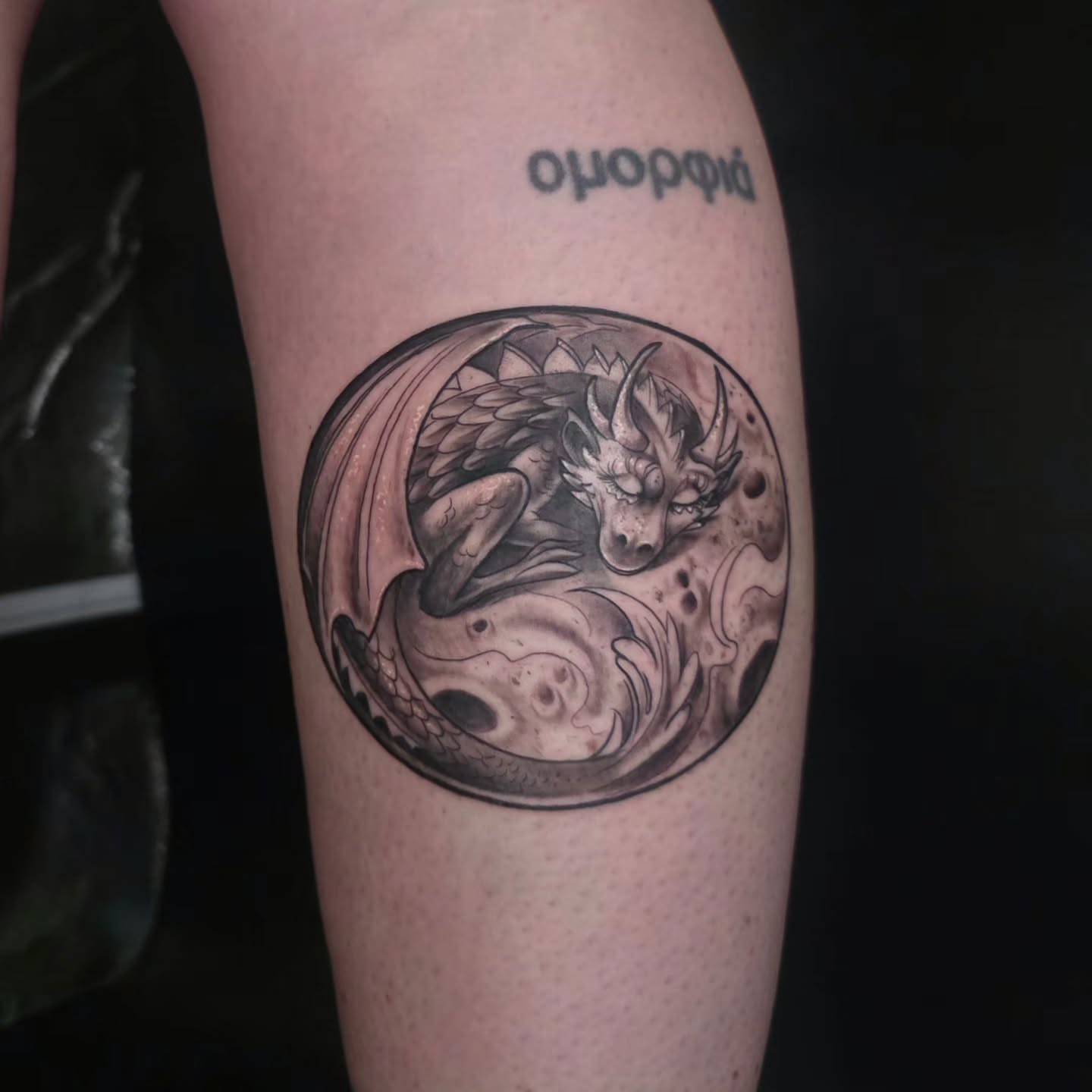 Dragon realism tattoo on the thigh by Kosta