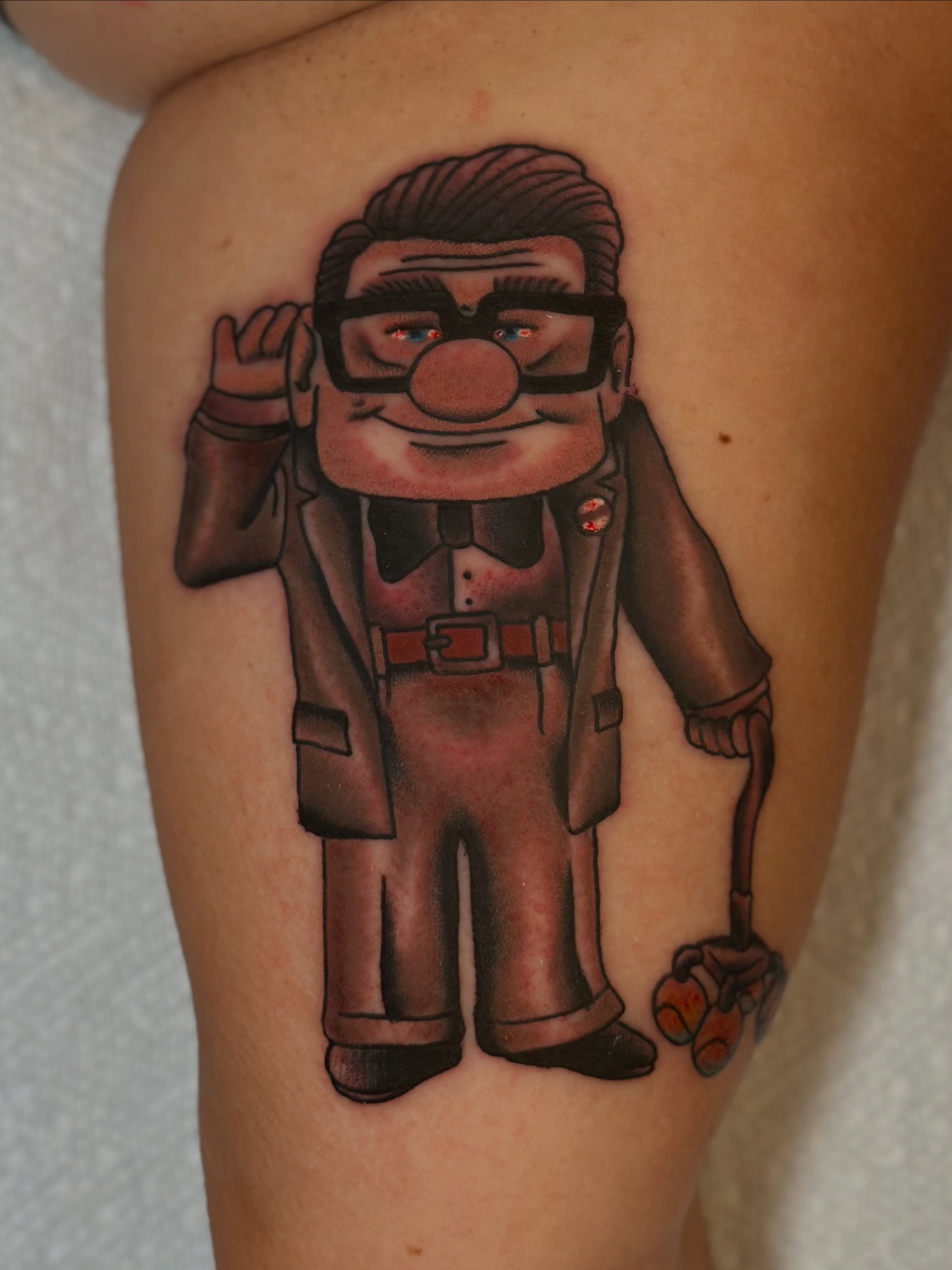 Clown character realism tattoo on the thigh by Michael Williams