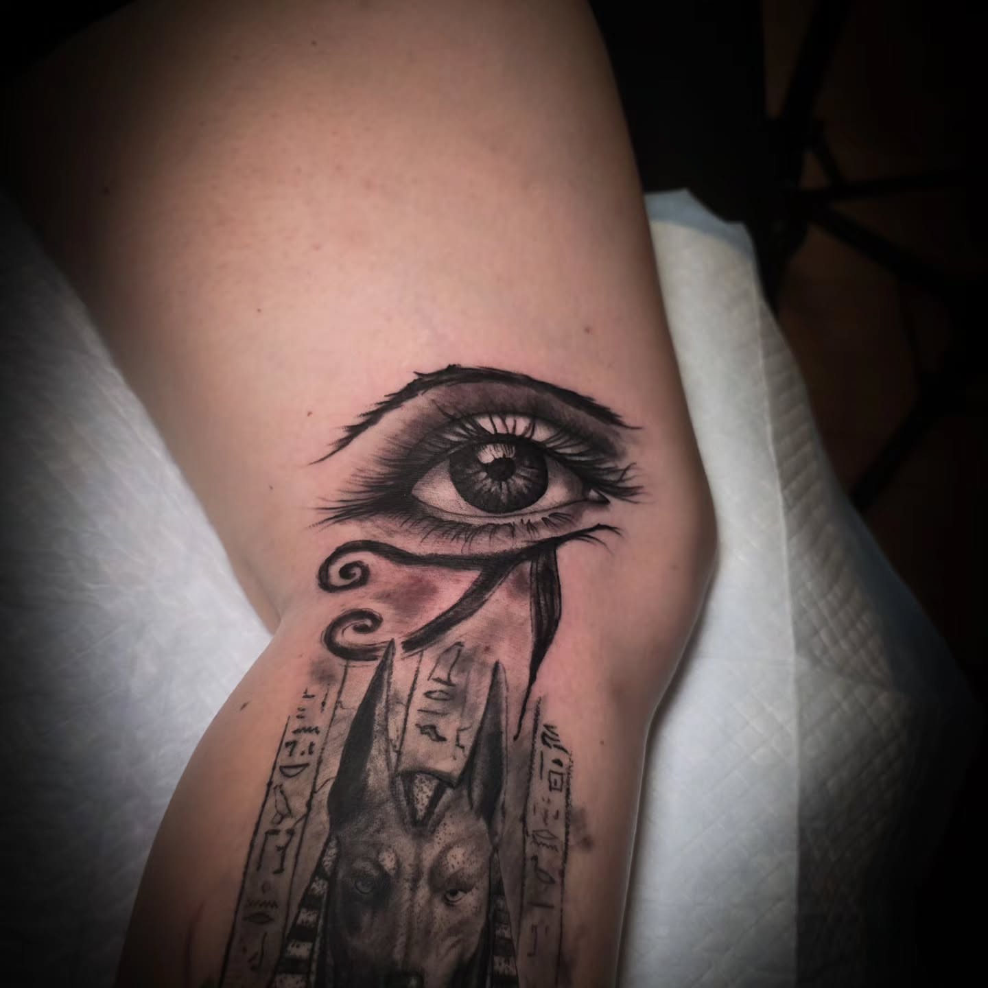 Eye and anubis realism tattoo on the forearm by John Christo Blake