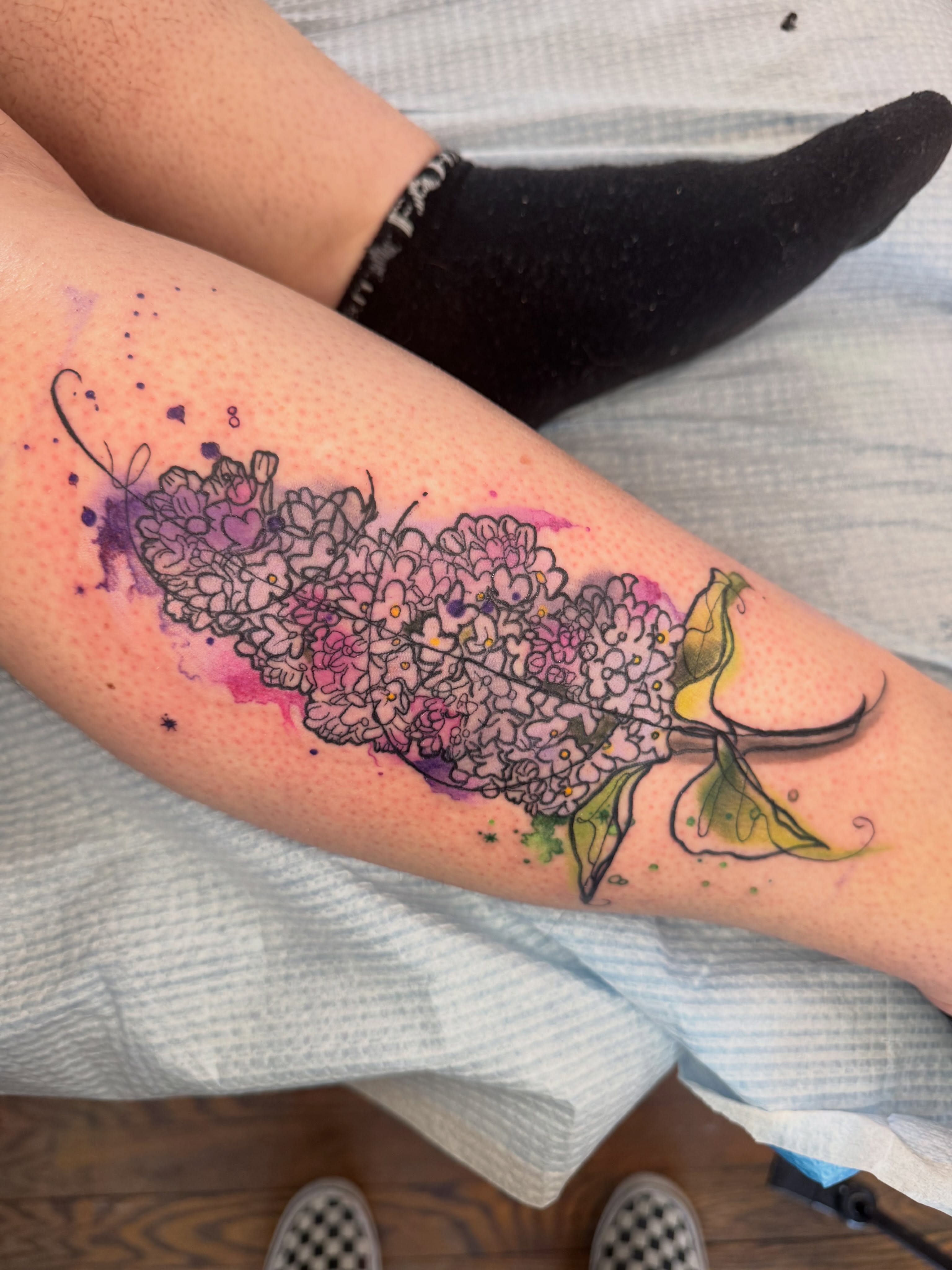 Hydrangea bouquet watercolor tattoo on the forearm by Paula.p.tattoos