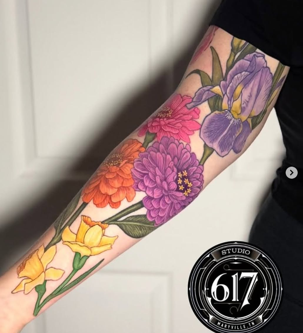 Floral bouquet realism tattoo on the forearm by Olivia DeCarr, Maryville, Tennessee
