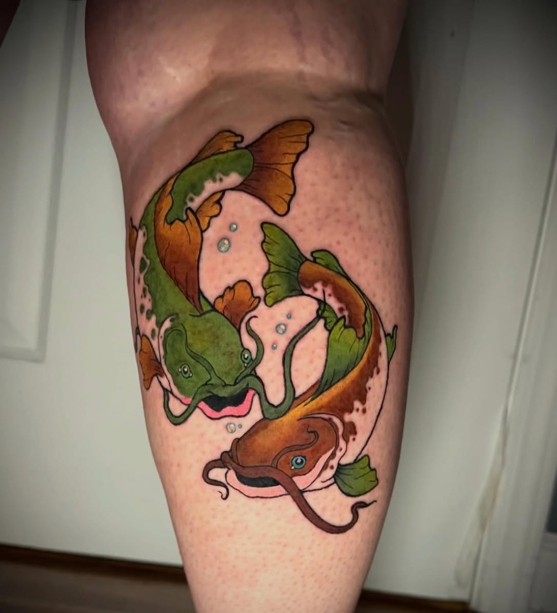 Koi fish new school tattoo on the thigh by Olivia DeCarr, Maryville, Tennessee