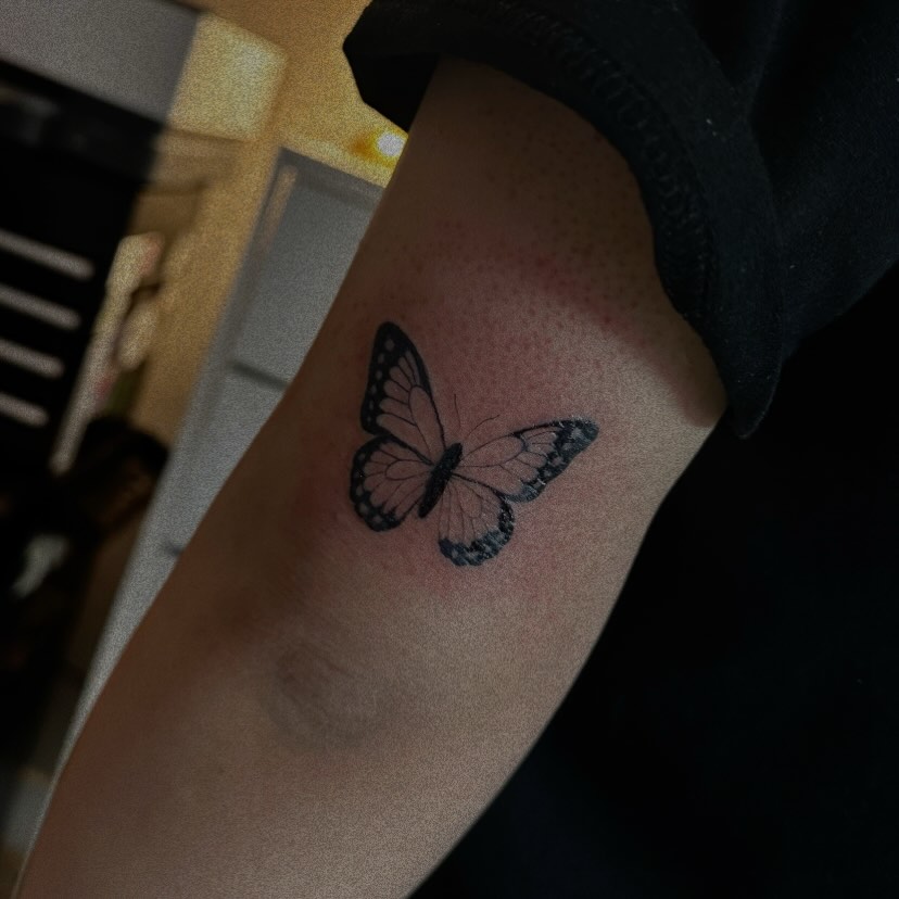 Butterfly dotwork tattoo on the forearm by Marly Quinn