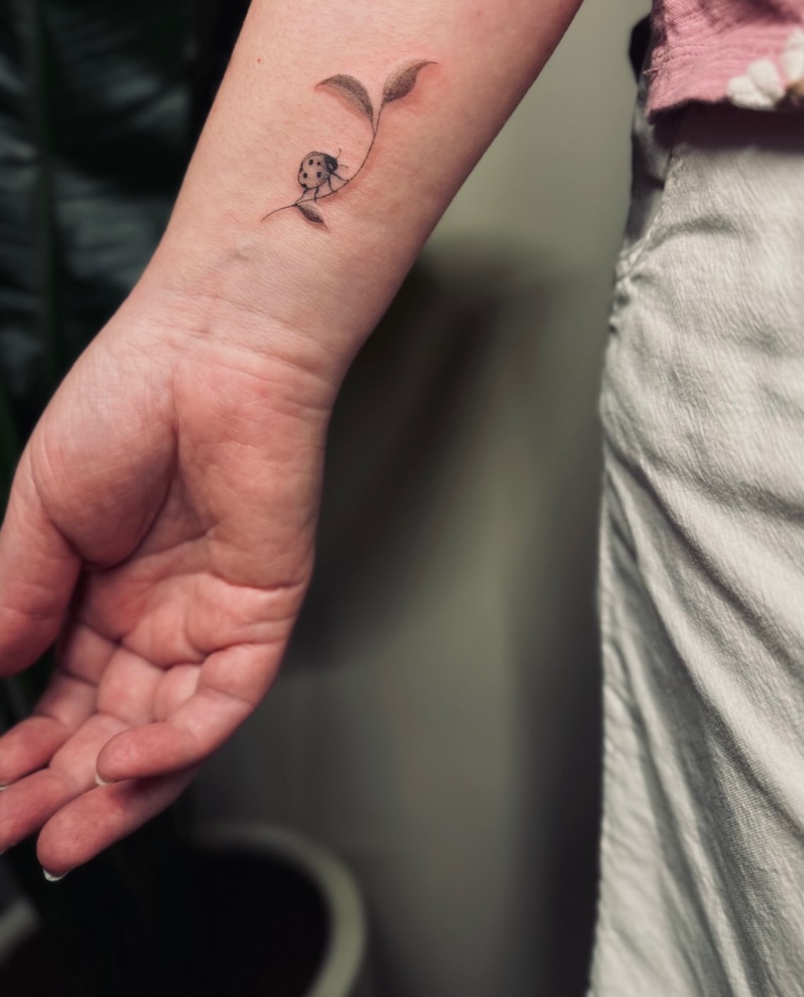 Ladybug dotwork tattoo on the forearm by Ashley Pilgreen
