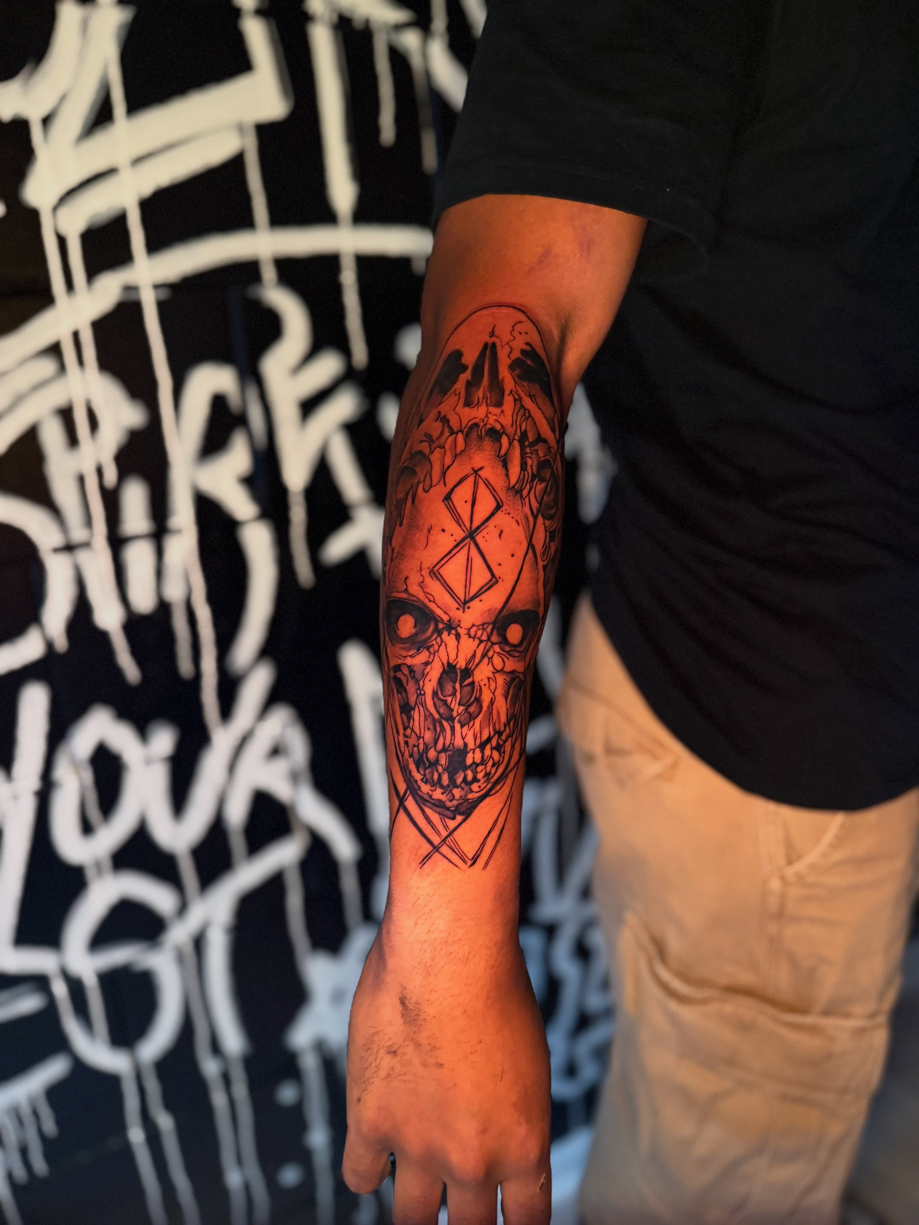 Skull dark realism tattoo on the forearm by Savannah Tattoo Artist