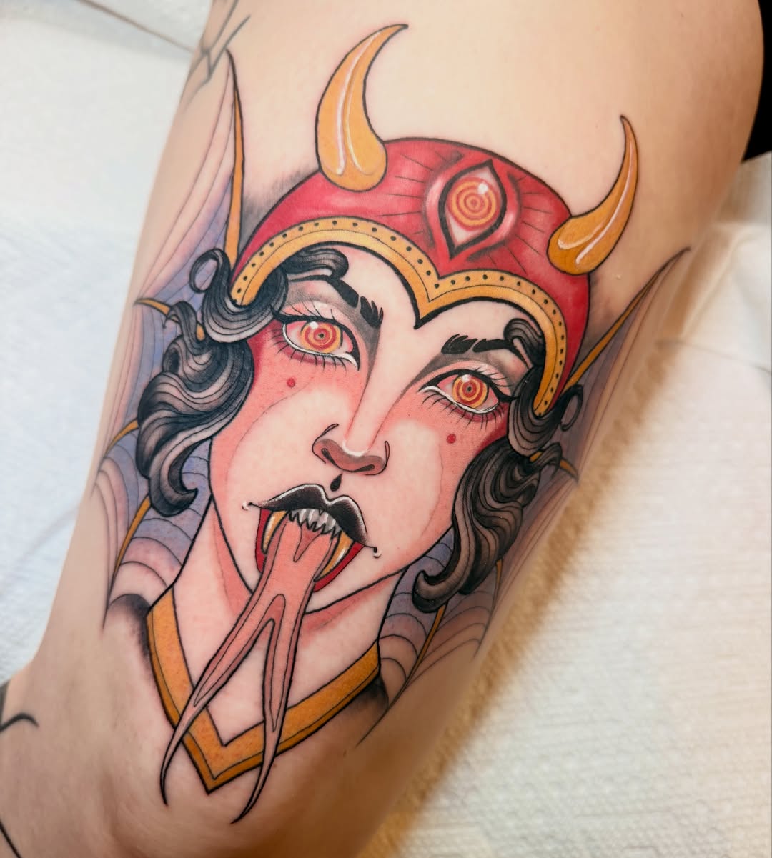 Woman with horns American traditional tattoo on the forearm by Jenn Golgan