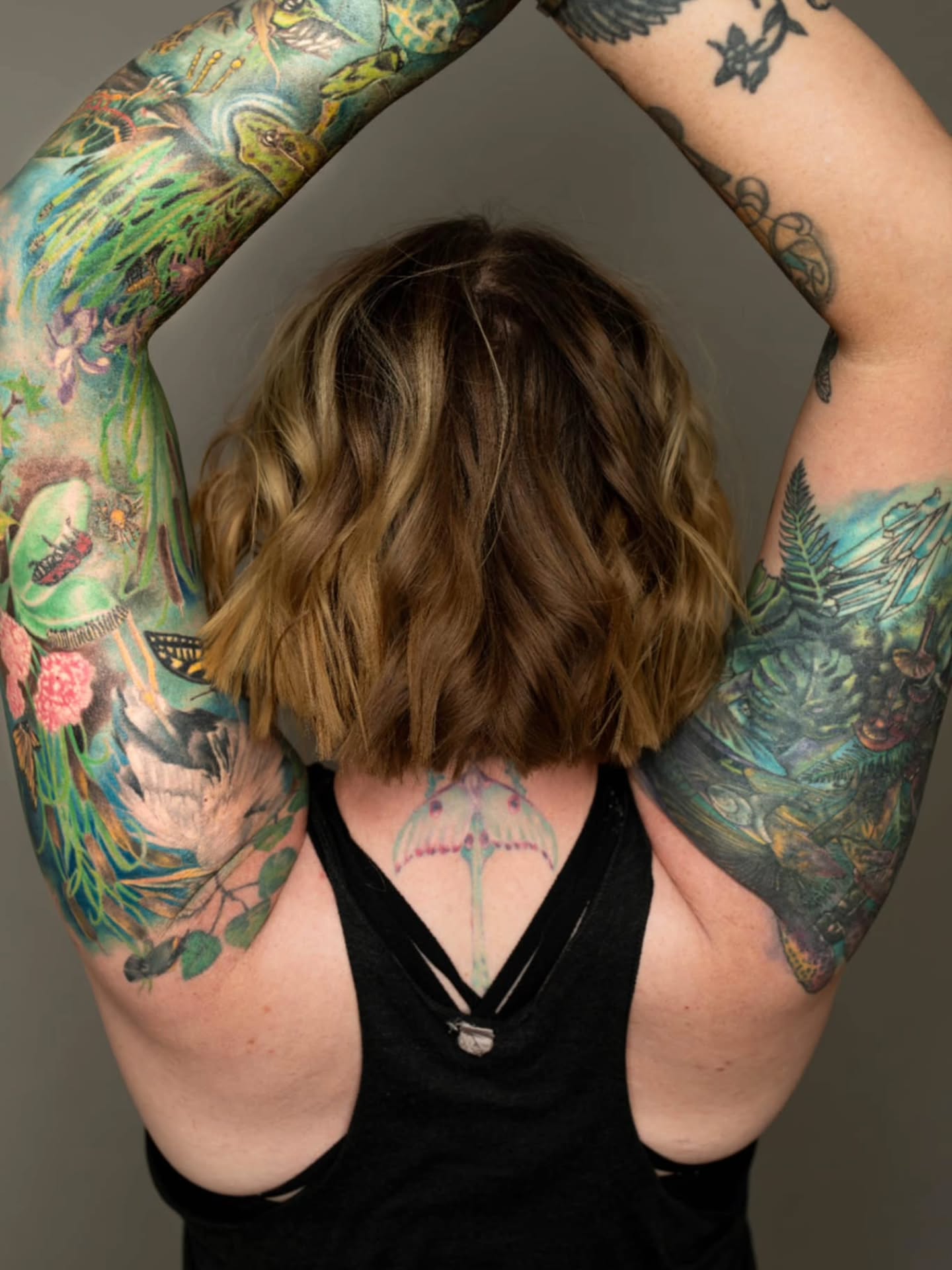 Tattooed arms dotwork tattoo on the upper arm by Heather