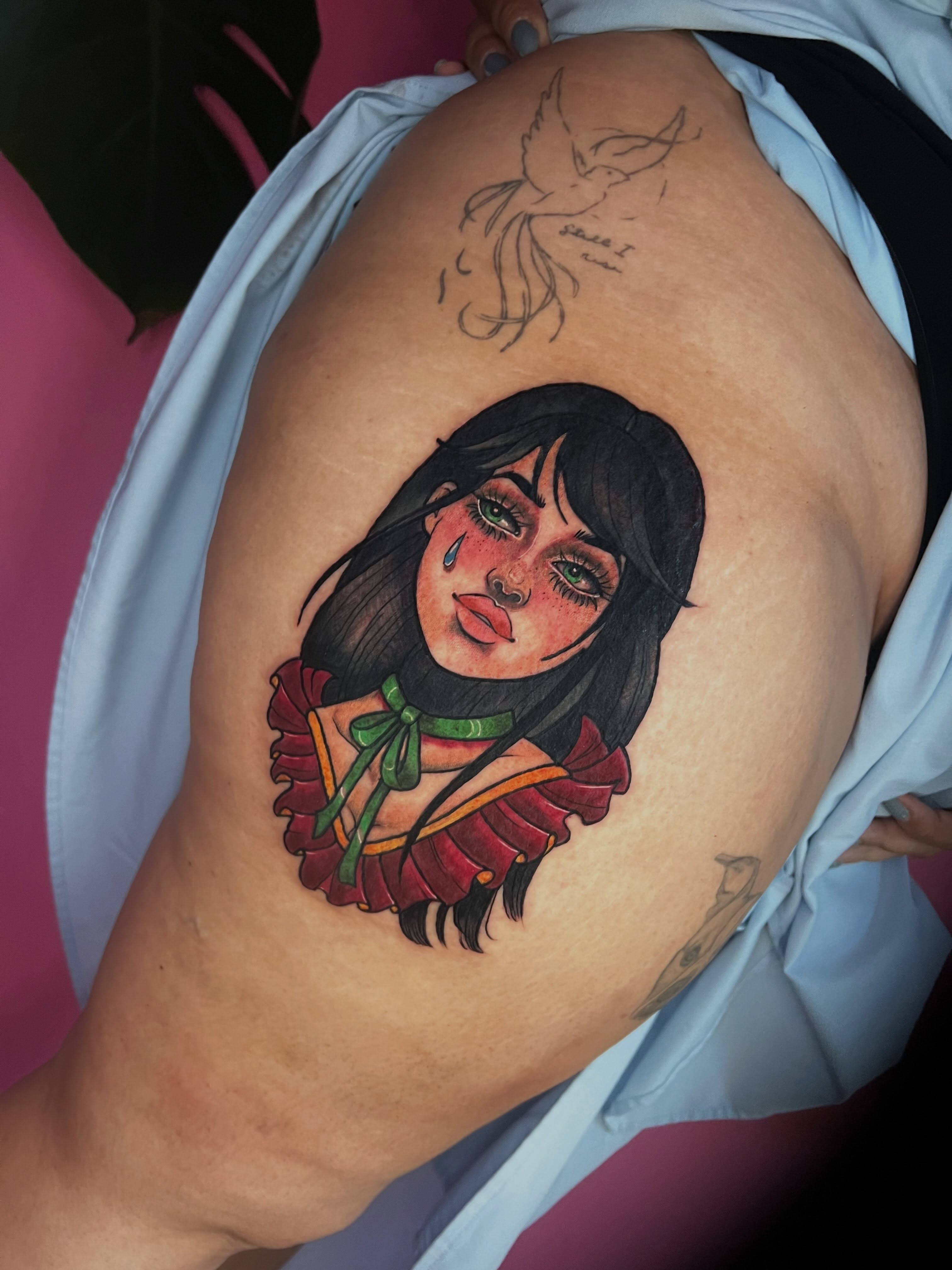 Girl with ruffled collar realism tattoo on the thigh by jessica valentine