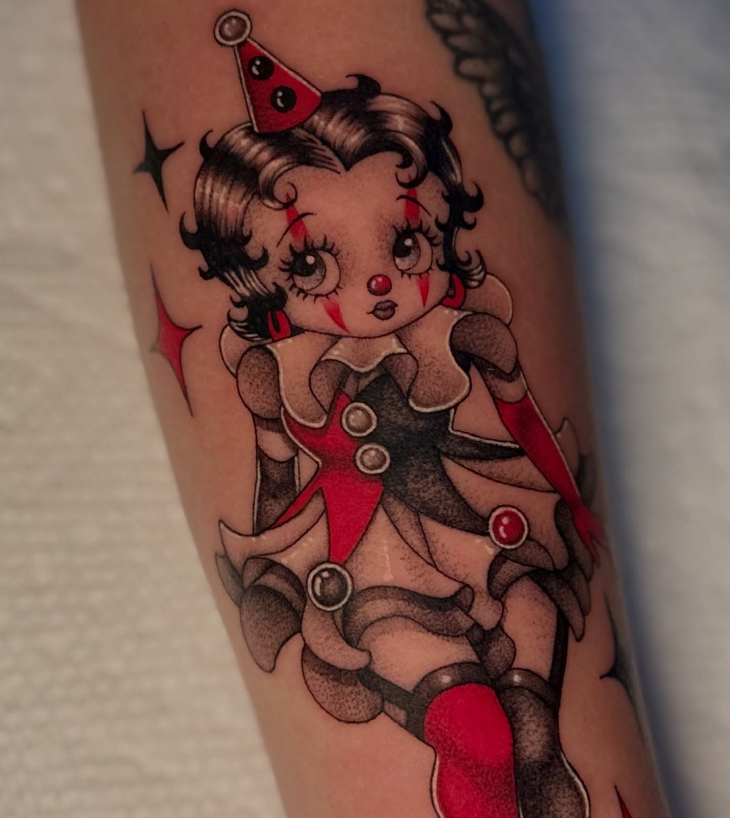 Doll American traditional tattoo on the forearm by Ghost