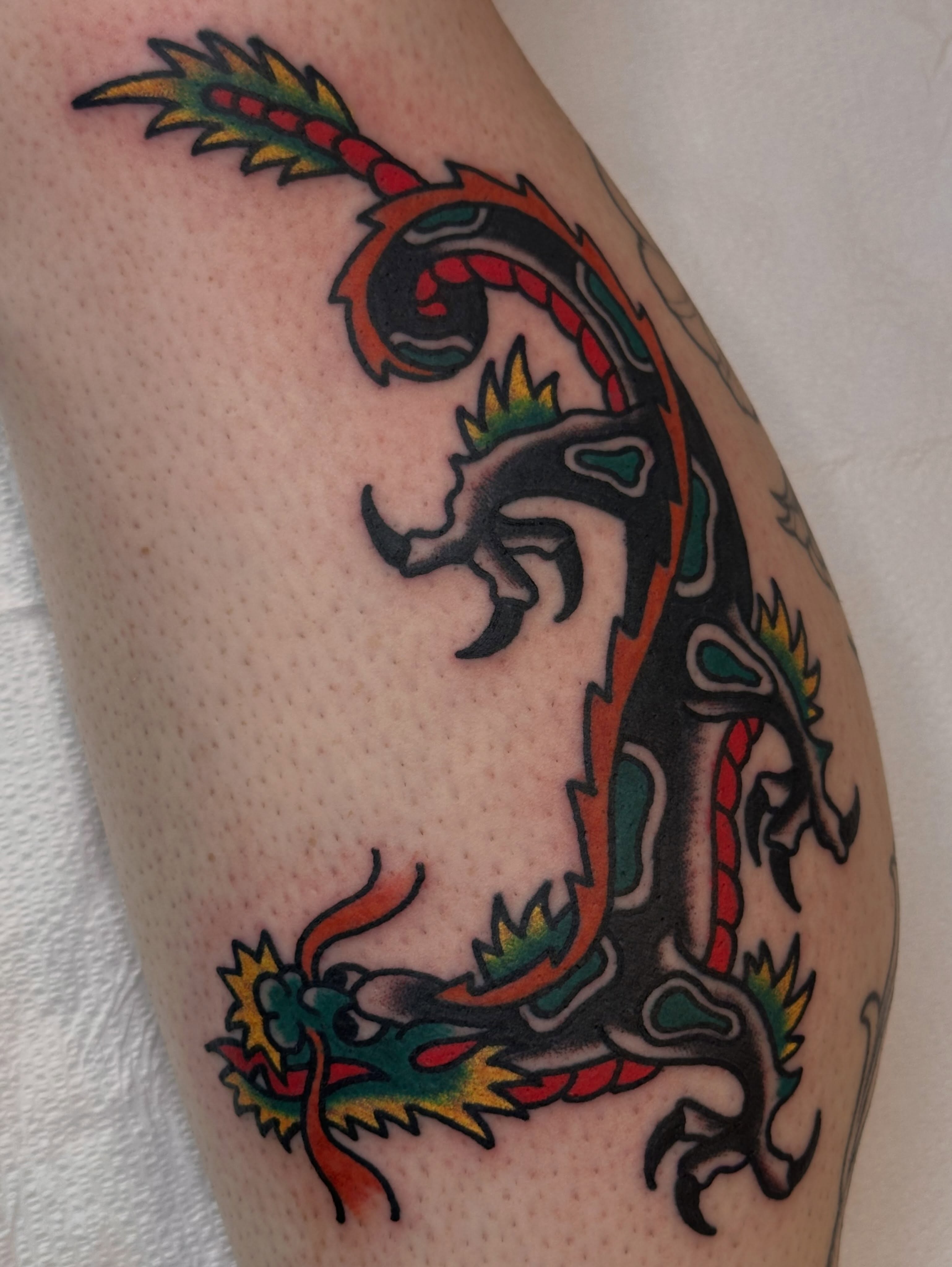 Dragon American traditional tattoo on the forearm by Cody Woolard, Seymour, Tennessee