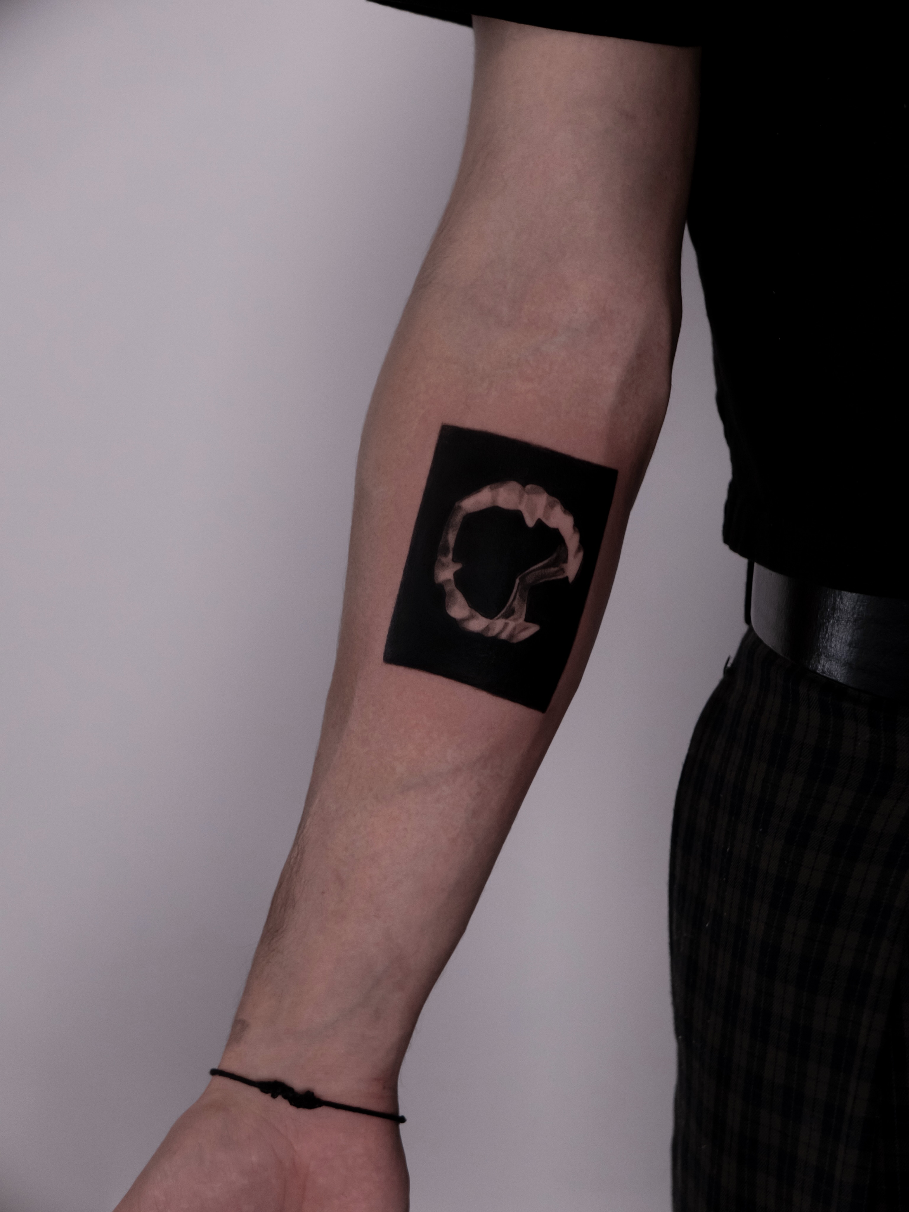 Abstract shape black and grey tattoo on the forearm by Mané, Portland, Oregon