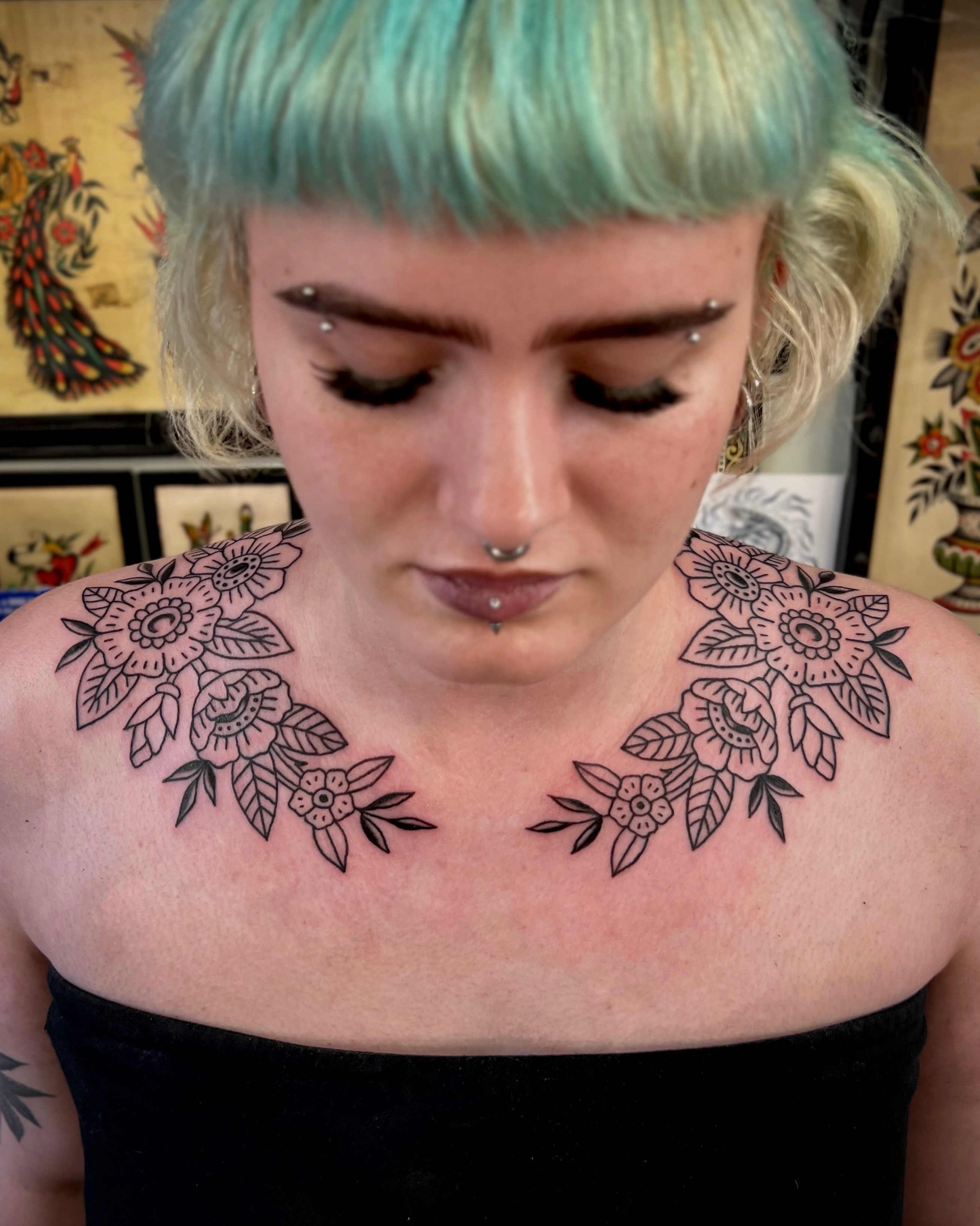 Floral black and grey tattoo on the shoulder by Brian Visser