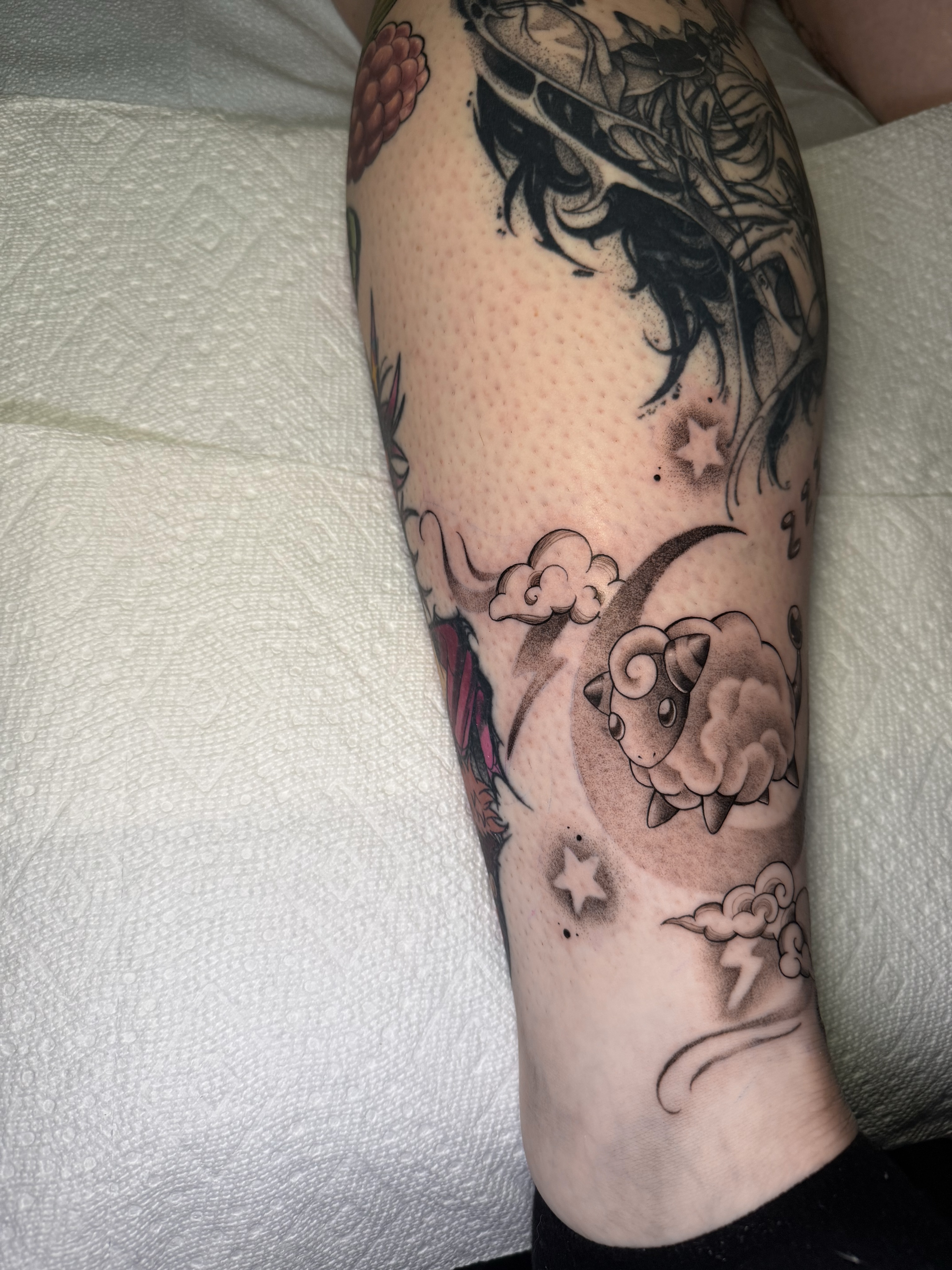 Sheep and crescent moon dotwork tattoo on the calf by 𝕹𝖆𝖙