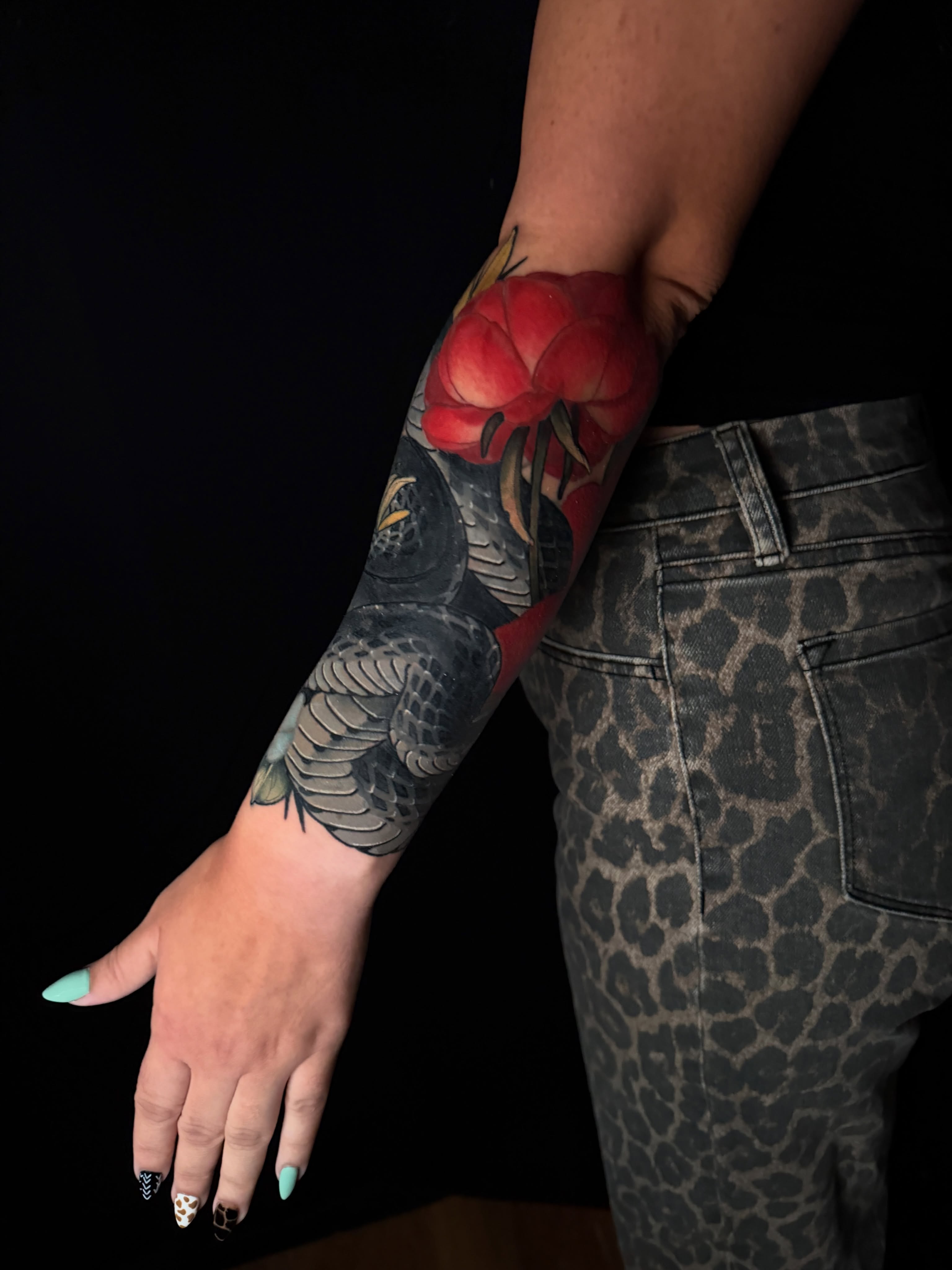 Peony and bird American traditional tattoo on the forearm by Brad Snow