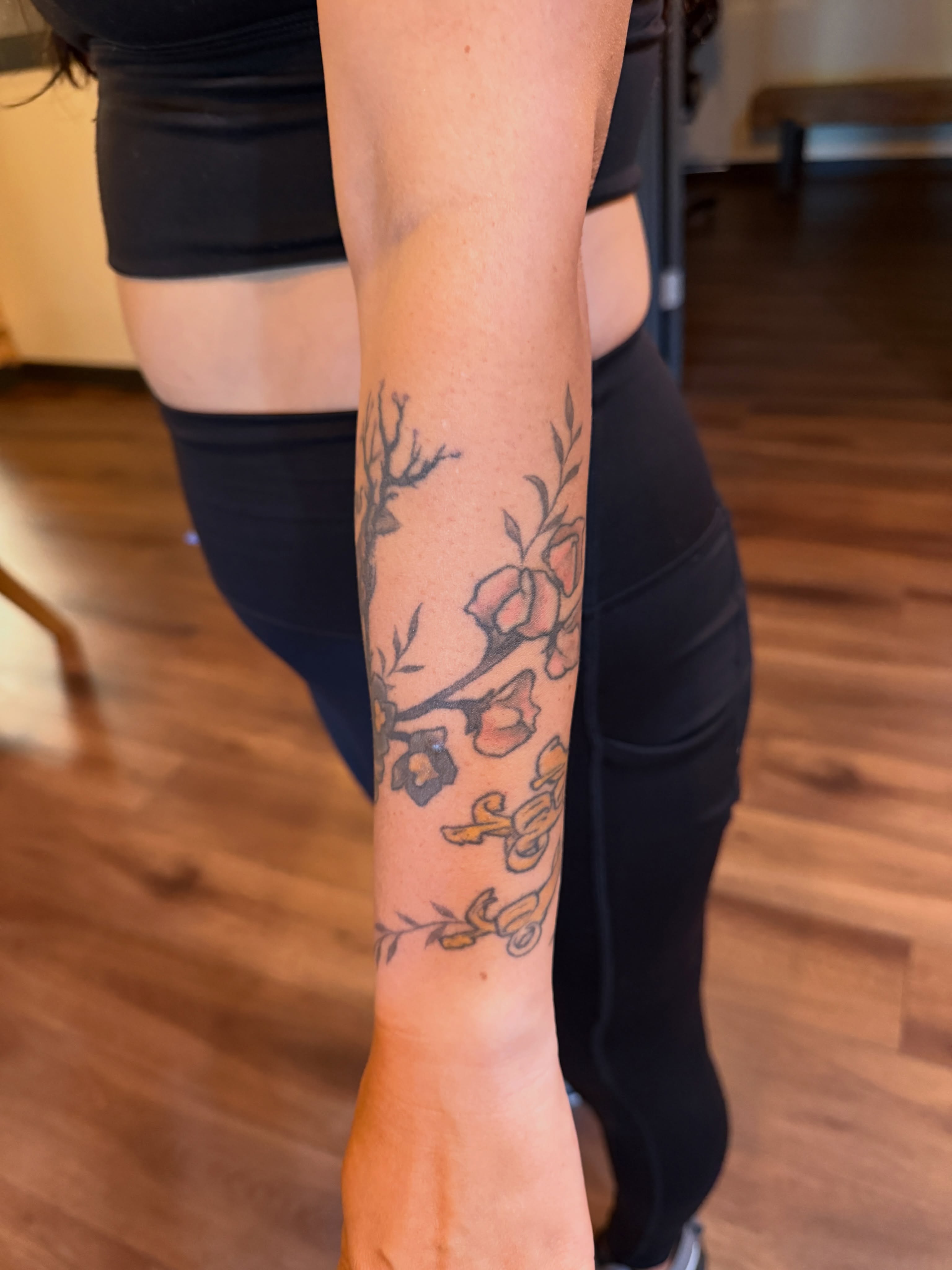 Floral branch new school tattoo on the forearm by Brad Snow
