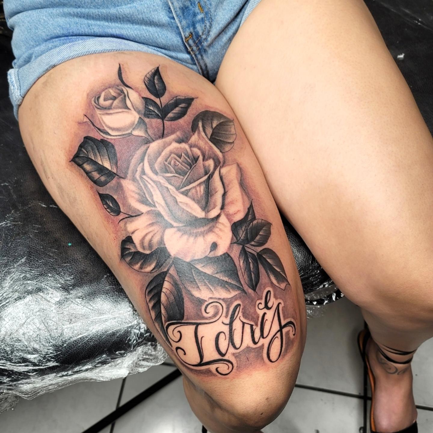 Rose black and grey tattoo on the thigh by Richie Garcia, Hesperia, California