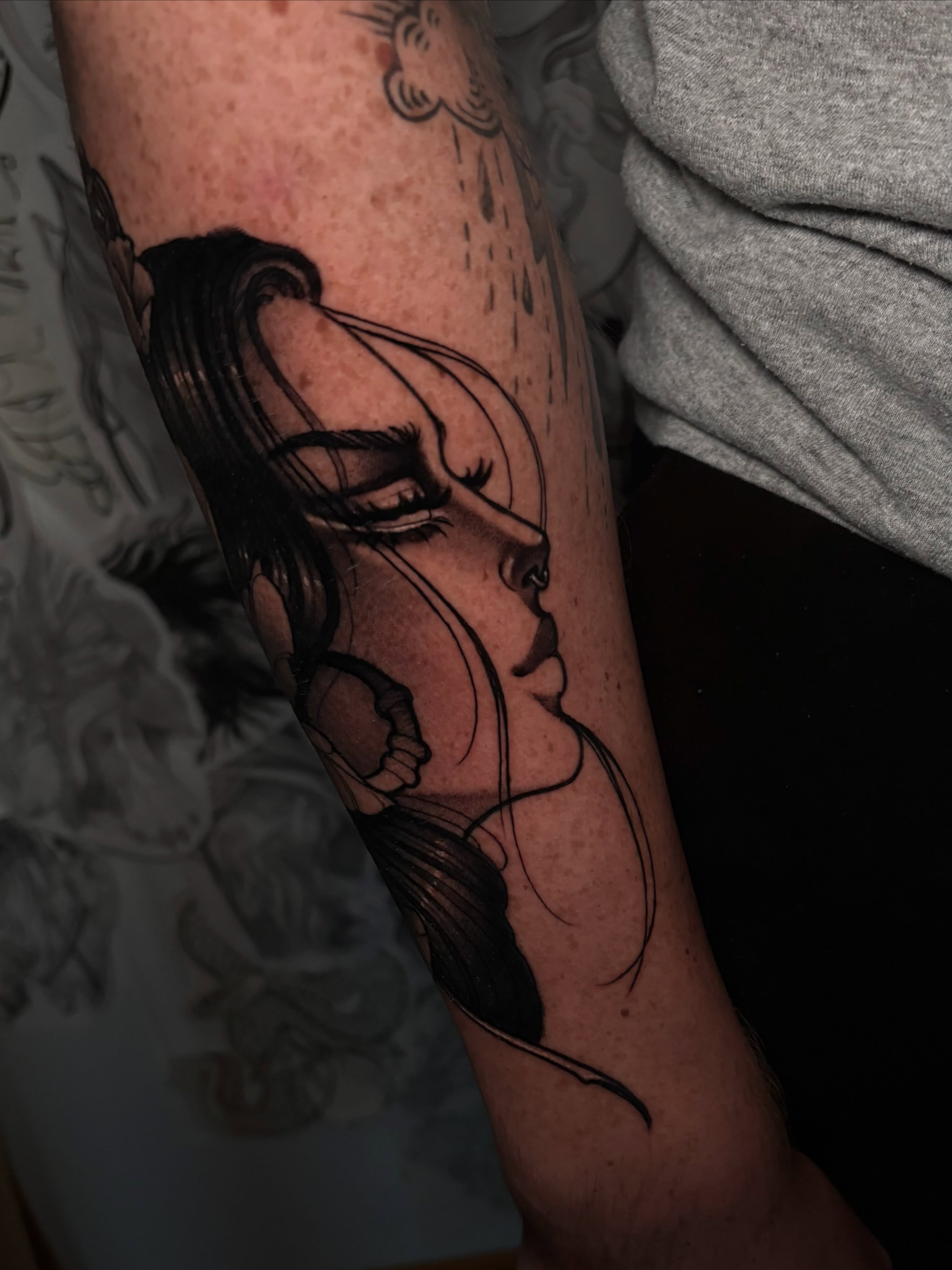 Woman's face realism tattoo on the forearm by 𝔗𝔞𝔶𝔩𝔬𝔯 𝔈𝔩𝔦𝔷𝔞𝔟𝔢𝔱𝔥, Tulsa, Oklahoma