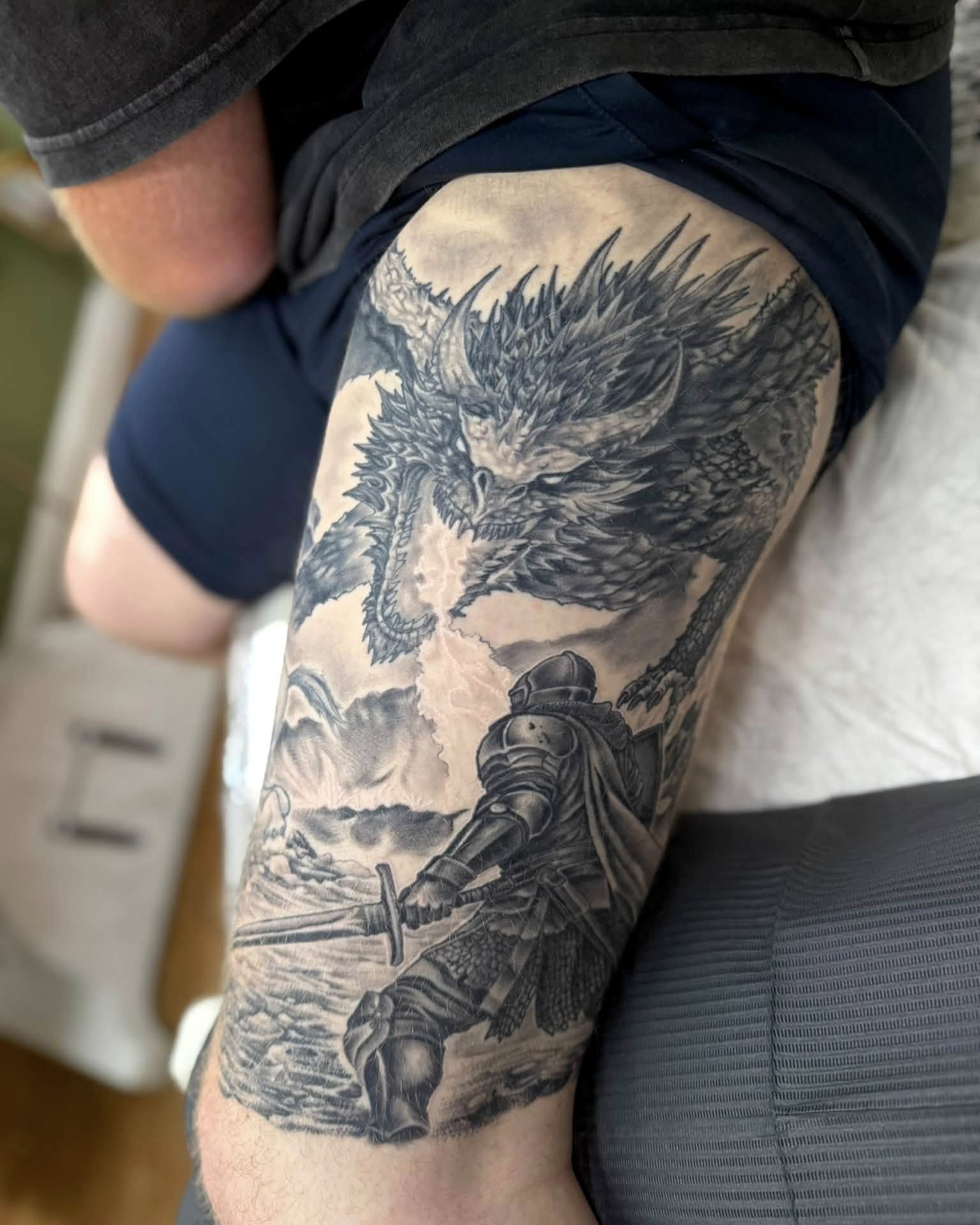Dragon and knight realism tattoo on the thigh by Corey Bailey, Stanton, Kentucky