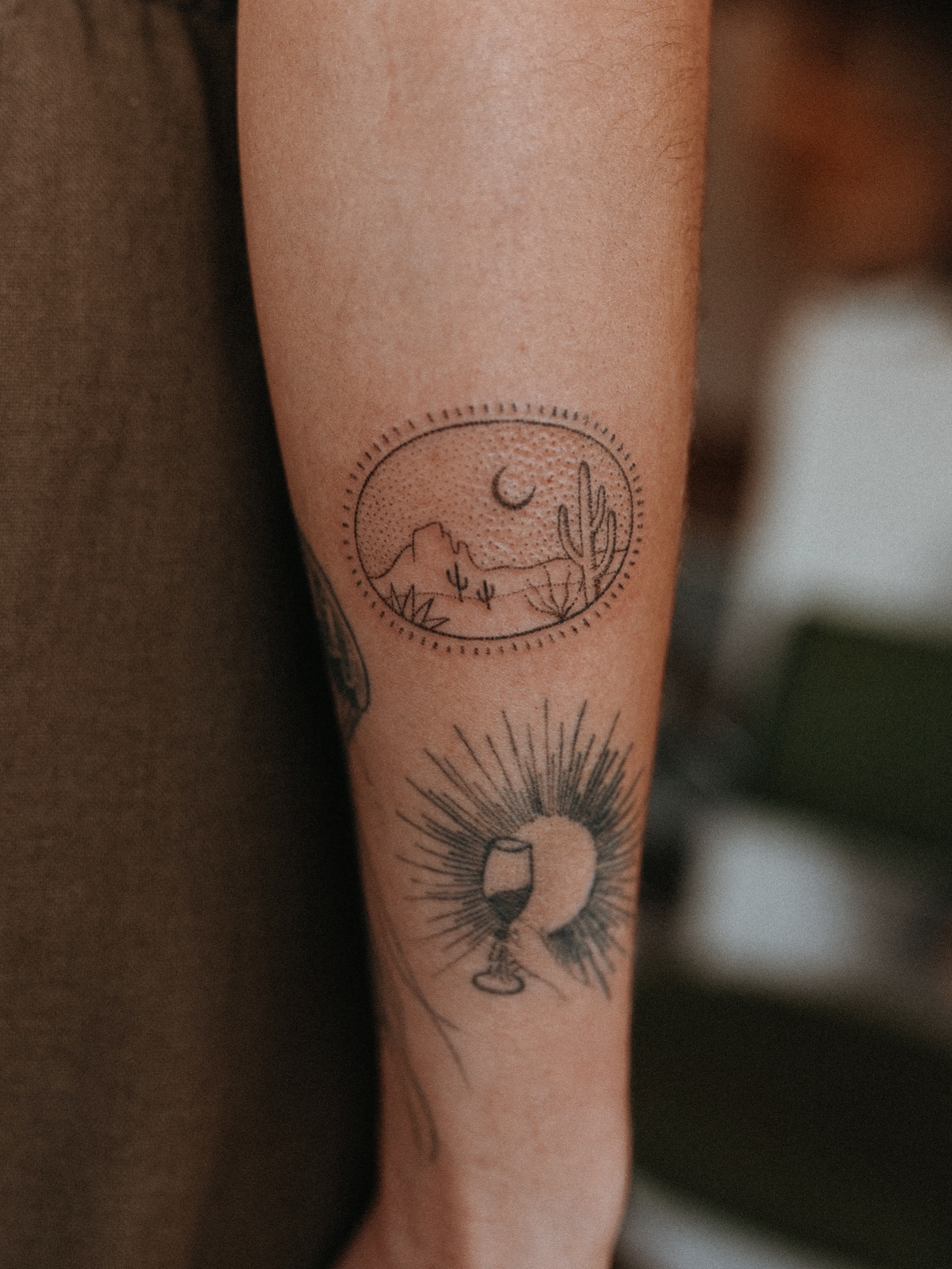 Desert landscape dotwork tattoo on the forearm by Grace Wise - Handpoke Tattoos