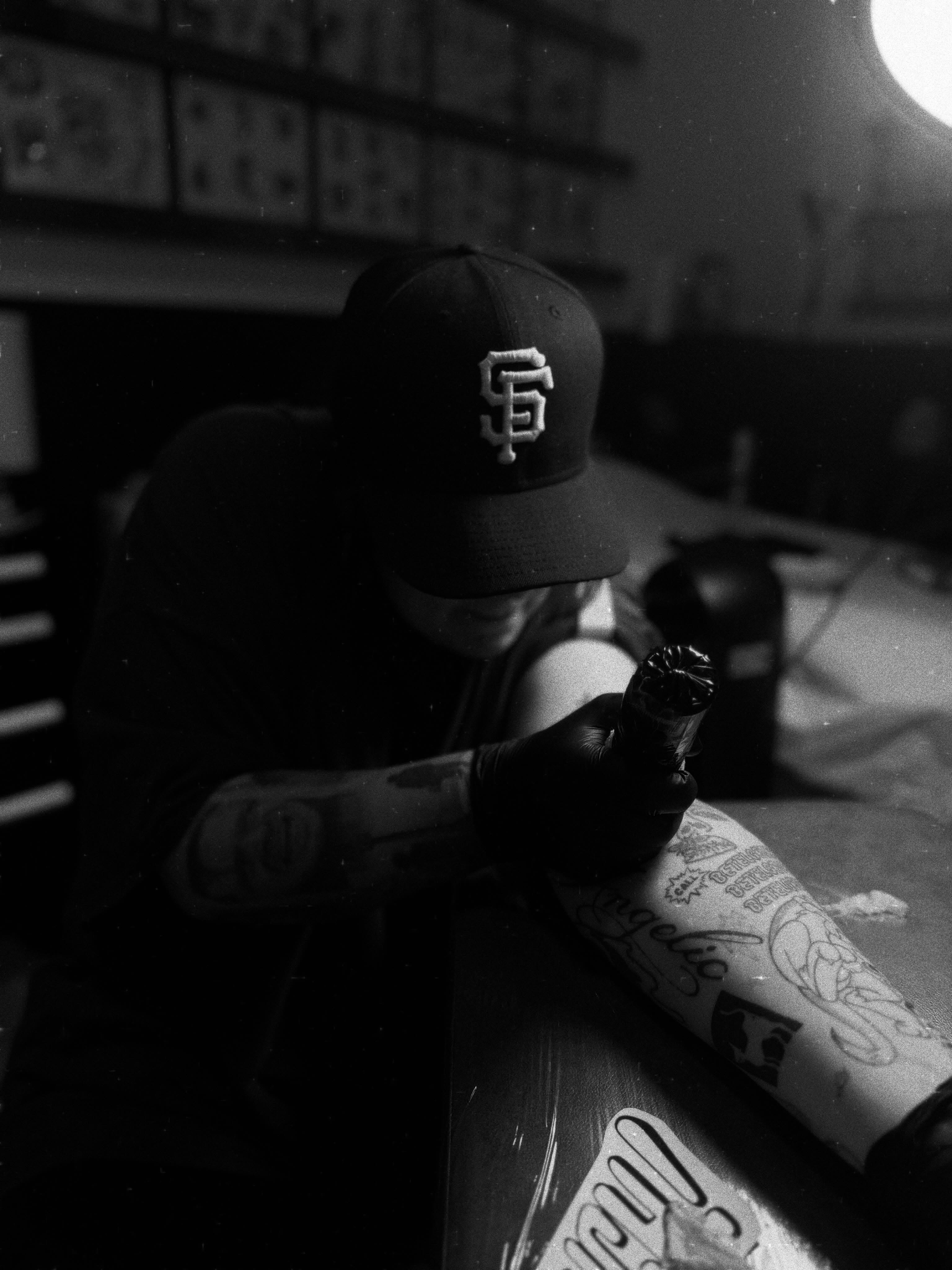 Tattoo artist black and grey tattoo on the upper arm by Sam Padilla