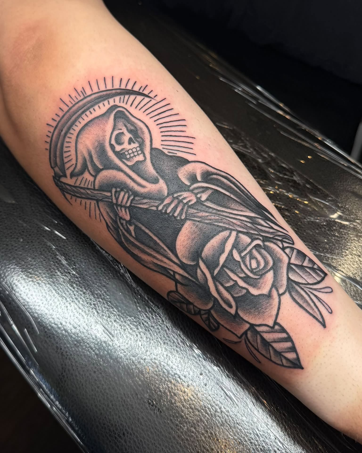 Reaper with rose black and grey tattoo on the forearm by Eden Rose, Kalama, Washington