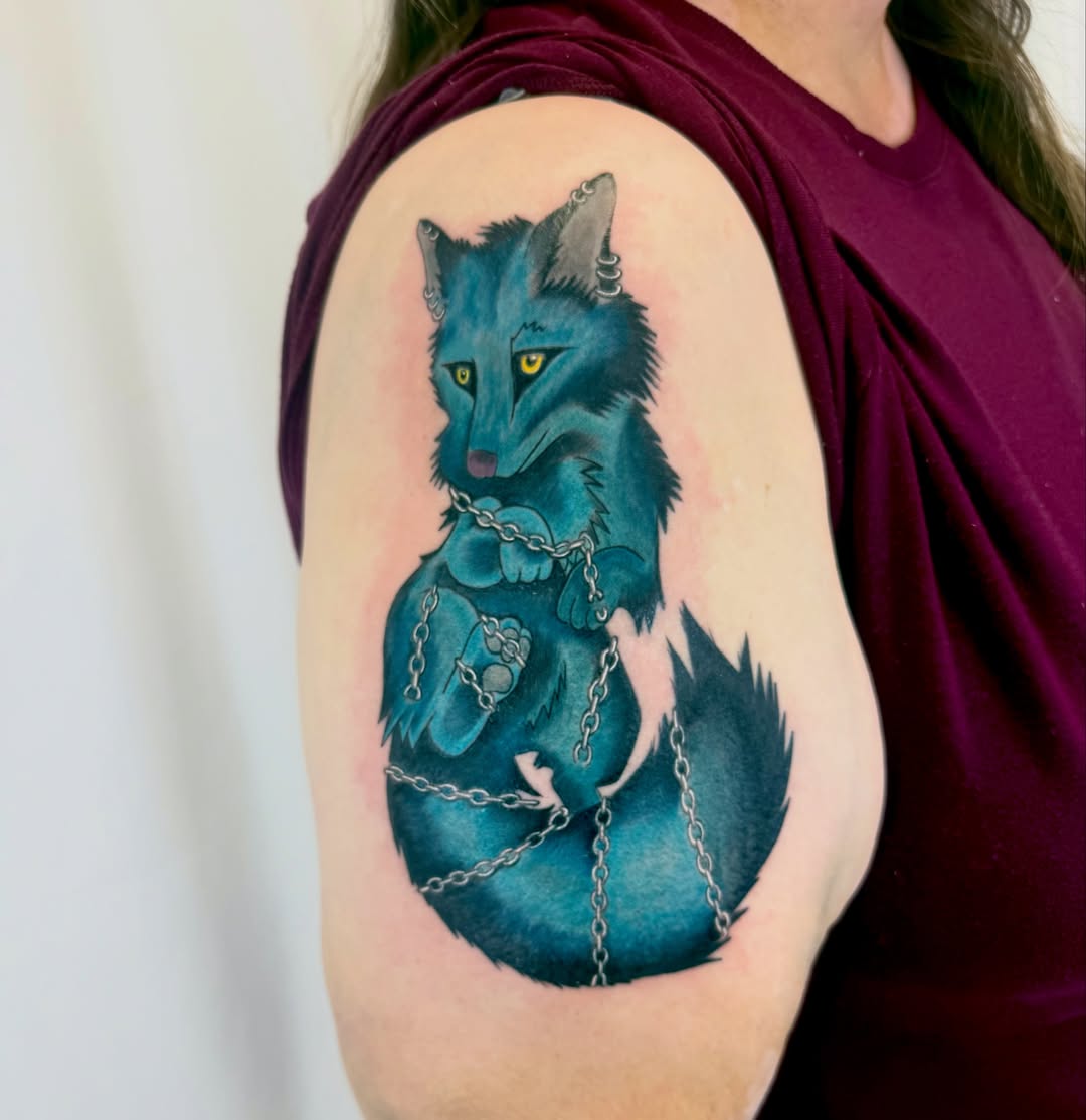 Blue fox realism tattoo on the shoulder by Jerry Thomas
