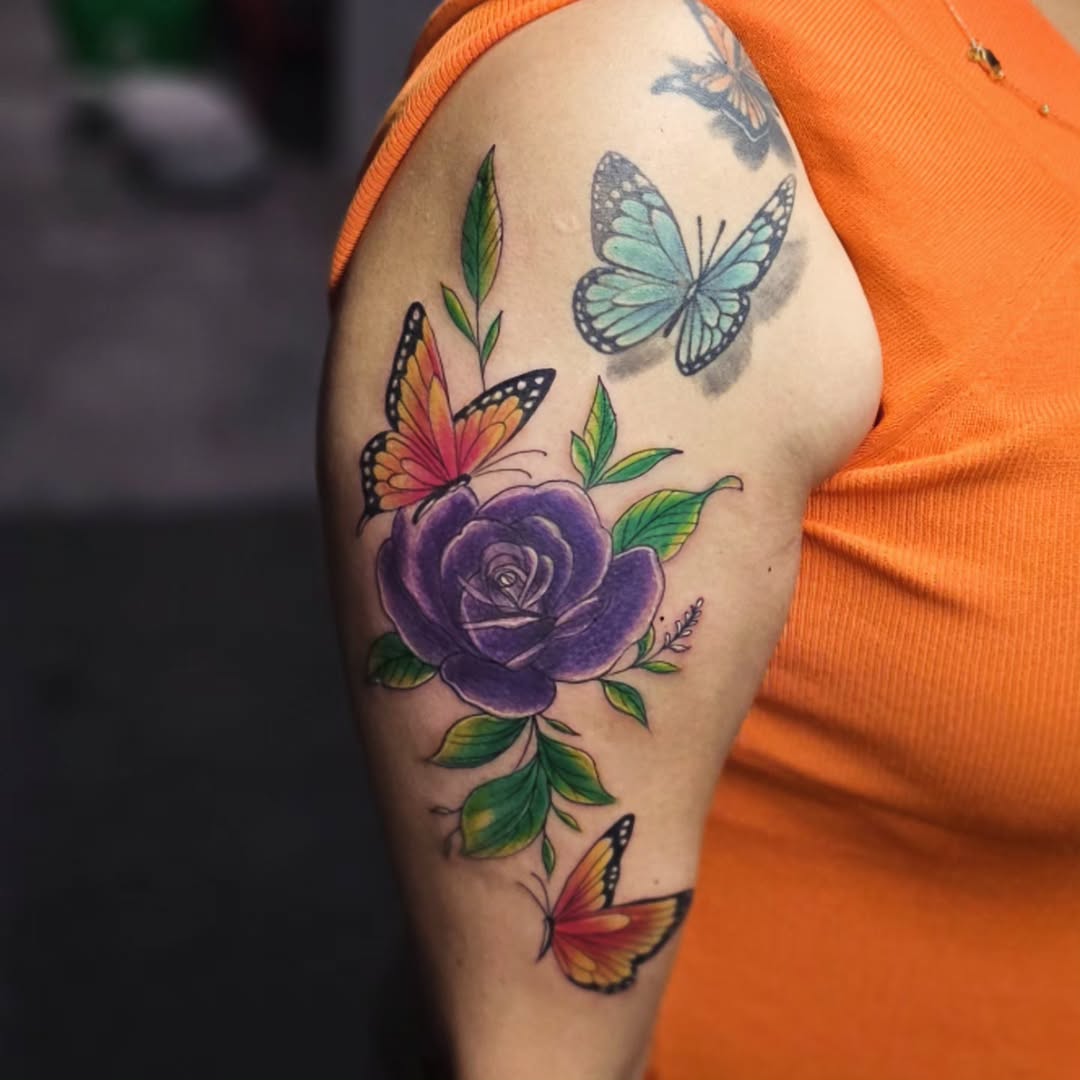 Purple rose and butterflies neo-traditional tattoo on the upper arm by Kai_Tattoo