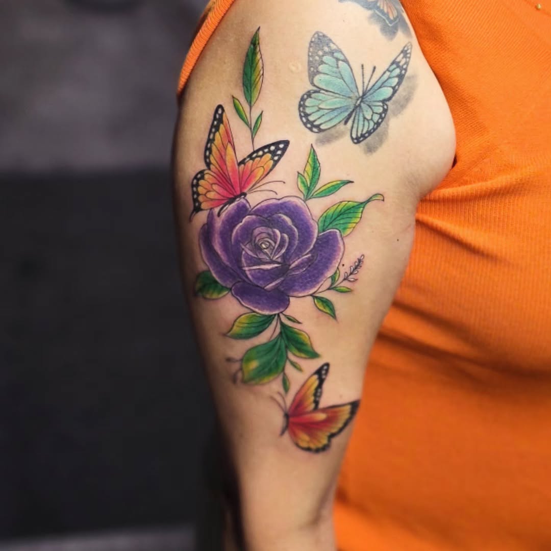 Rose and butterflies neo-traditional tattoo on the upper arm by Kai_Tattoo
