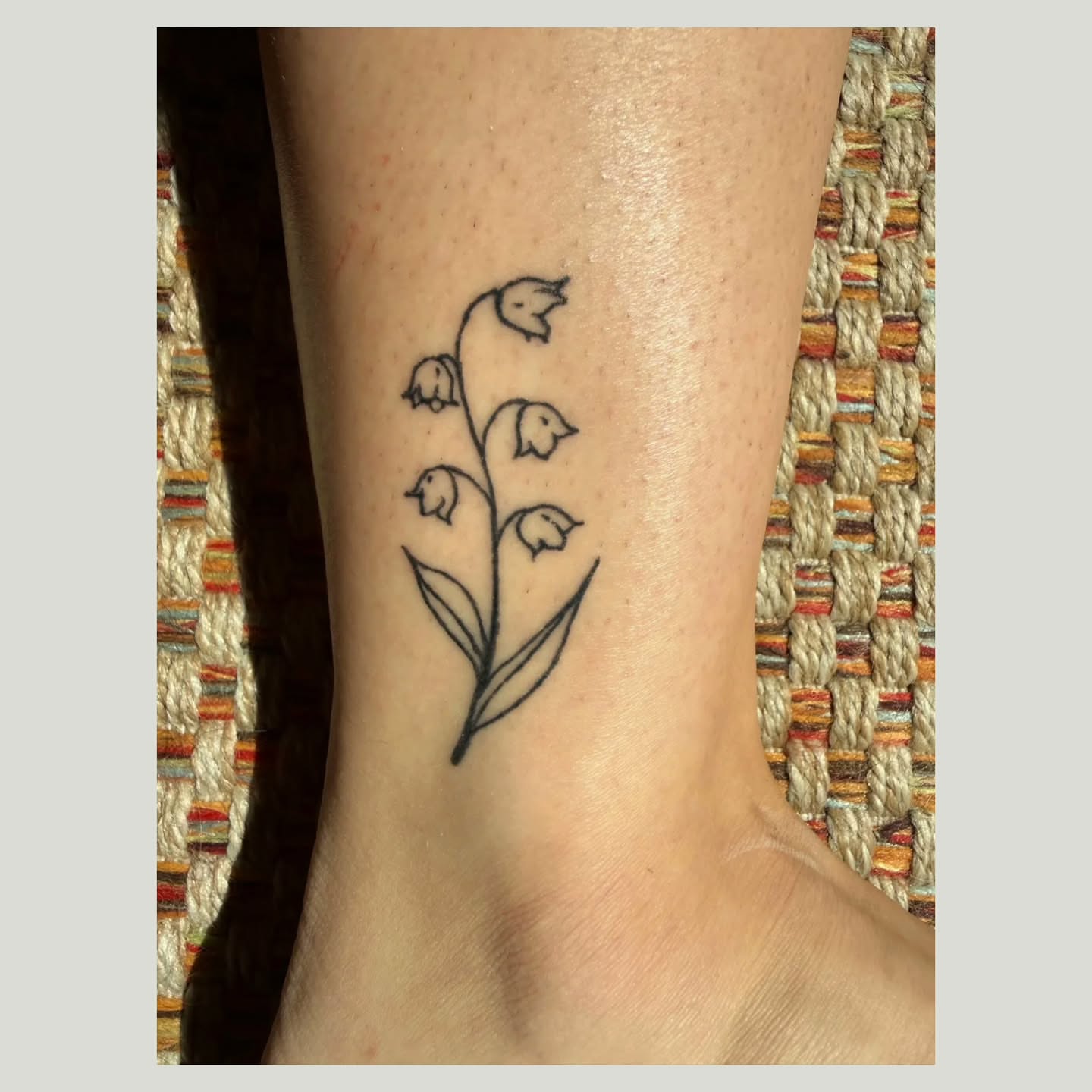 Lily of the valley fine line tattoo on the calf by The Fabled Tattooist (Alyssa Summers), Eagle Point, Oregon