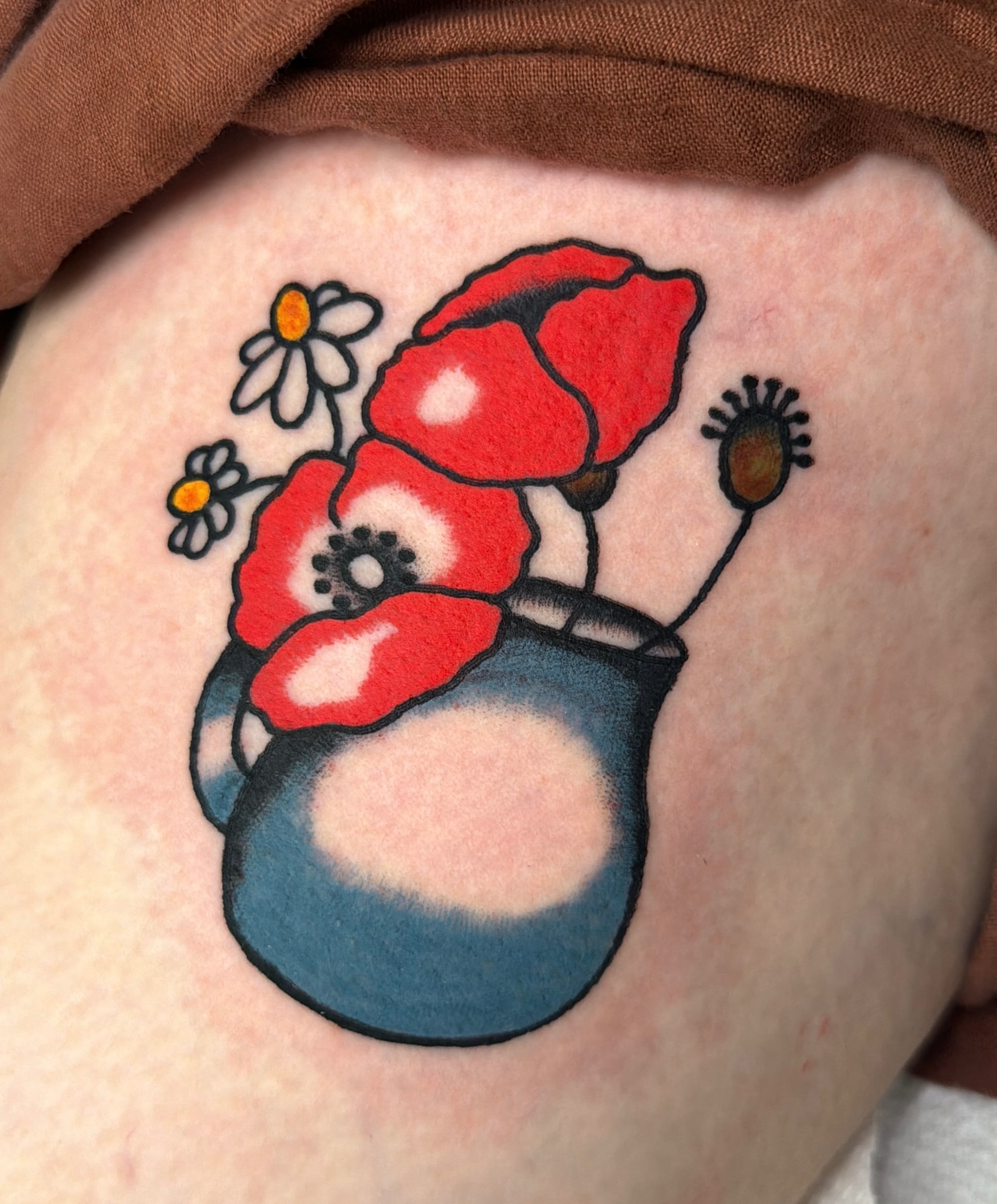 Flowers in a vase dotwork tattoo on the thigh by Emma Fox Tattoo