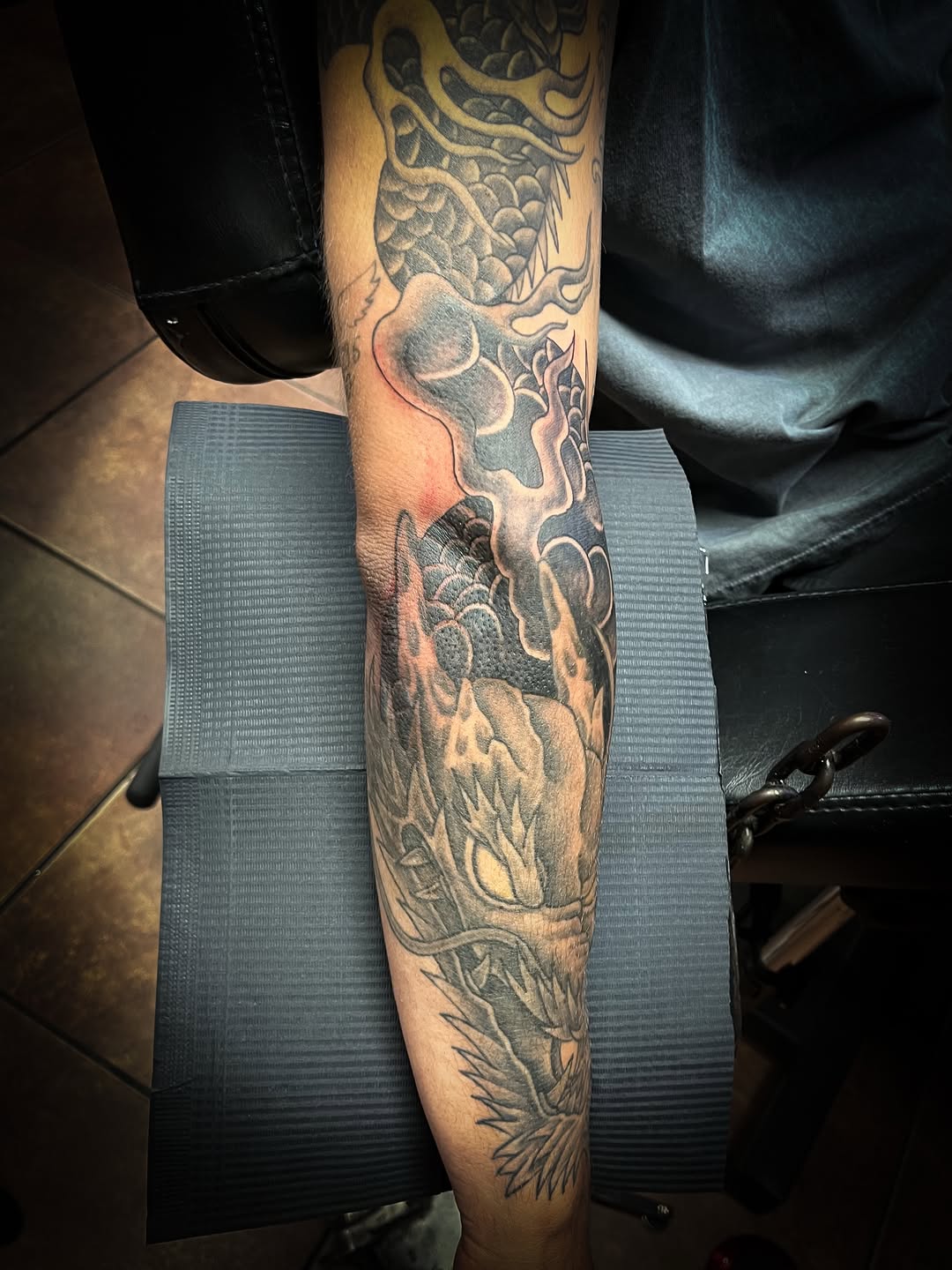 Dragon and clouds Japanese tattoo on the forearm by Melissa Peña NYC