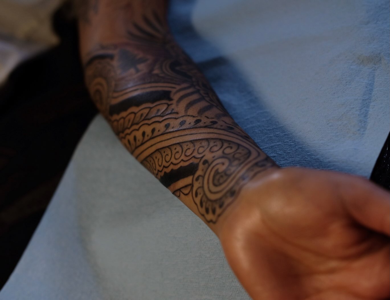 Geometric pattern geometric tattoo on the forearm by Owlyn Madrone