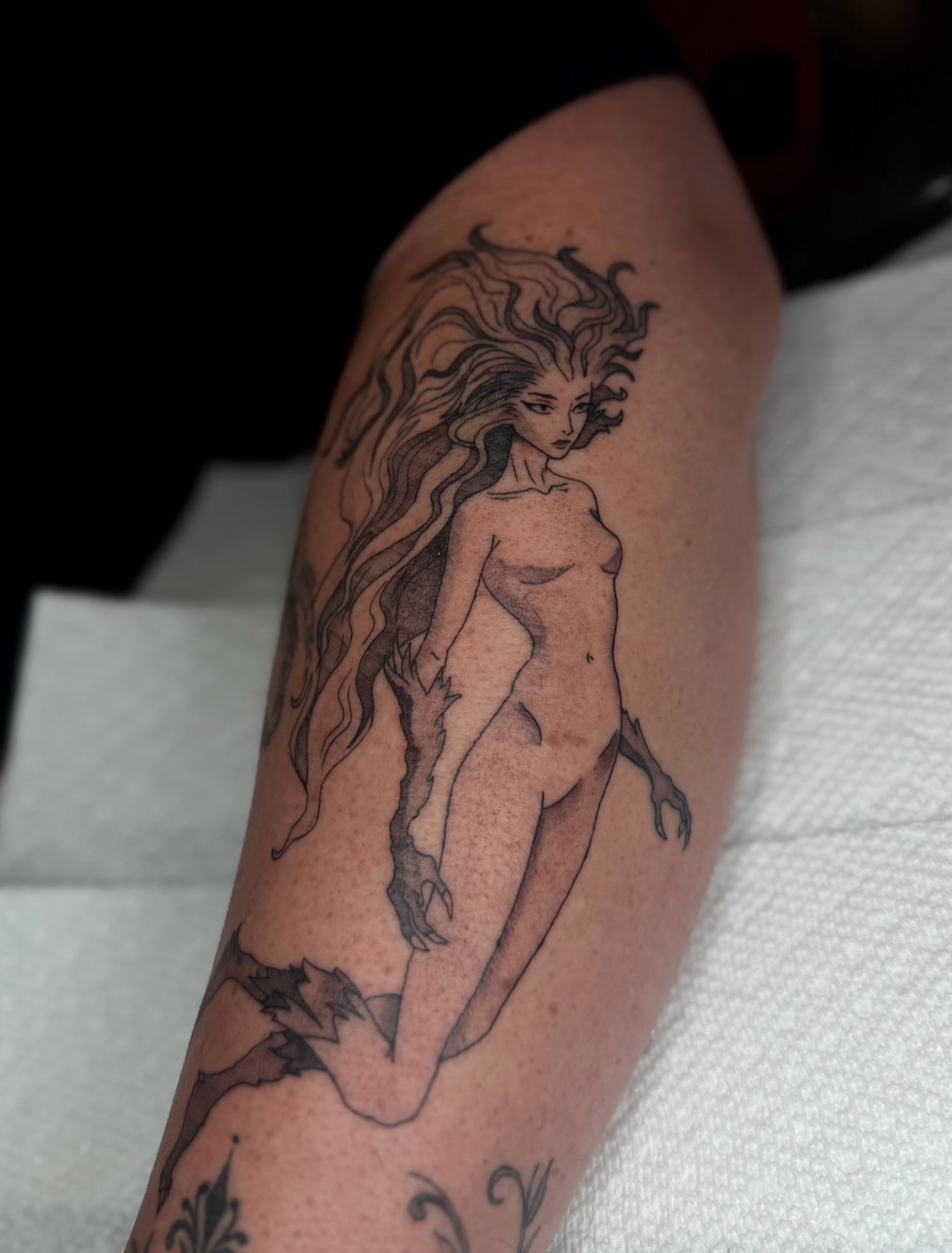Mermaid black and grey tattoo on the thigh by Brandi 🕷, Mentor, Ohio