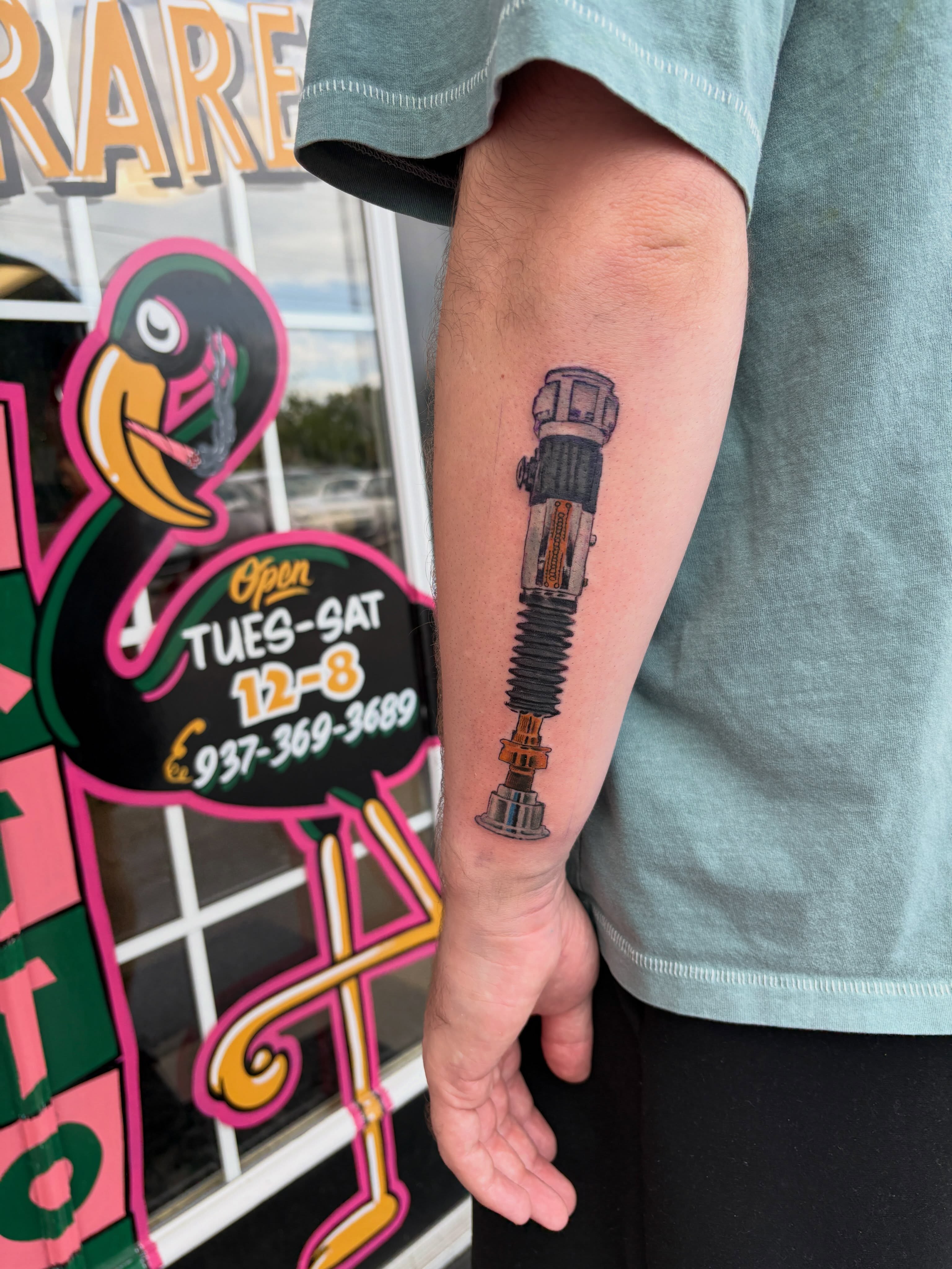 Gun realism tattoo on the forearm by Joshua Scott