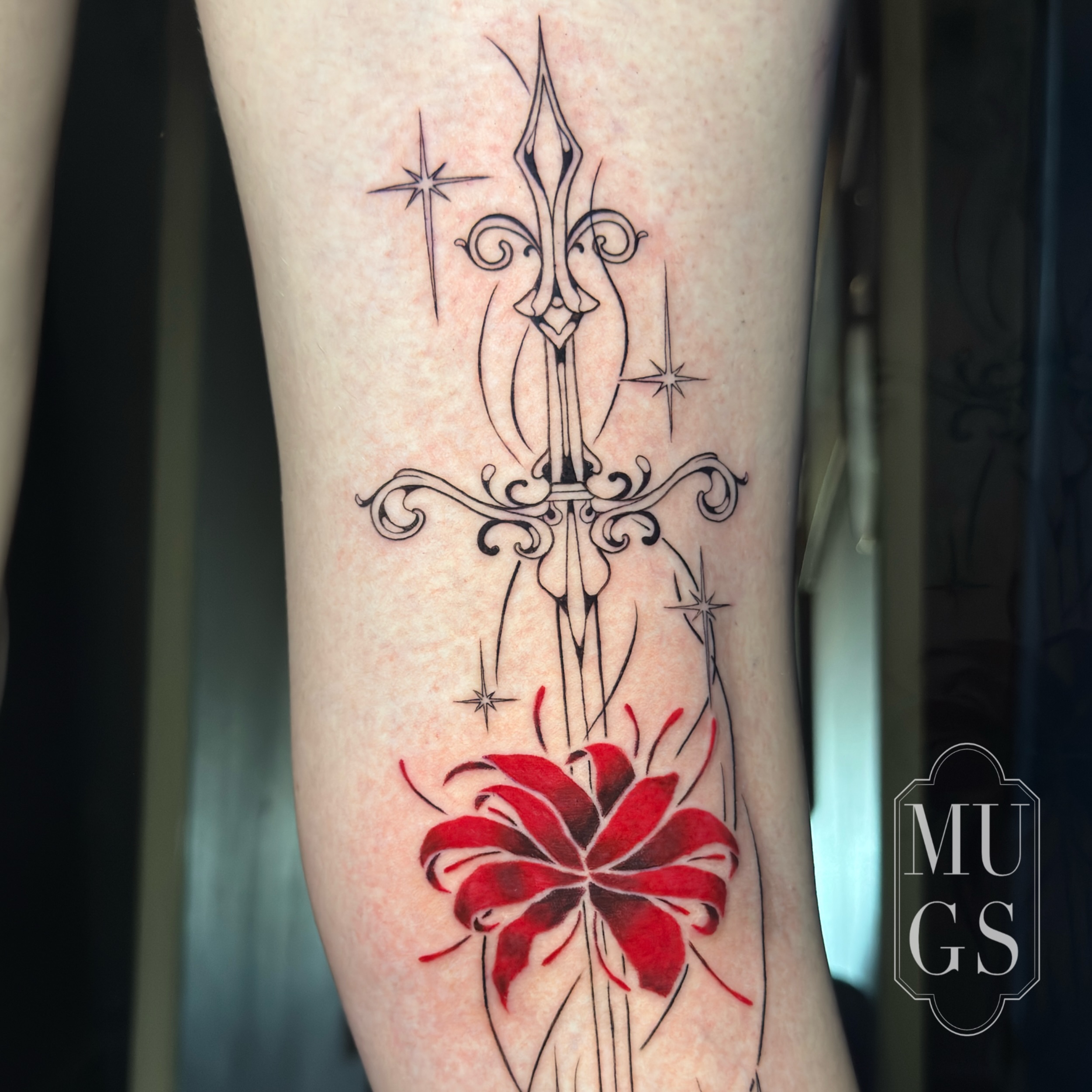Sword and lily ornamental tattoo on the forearm by Emily Andreozzi