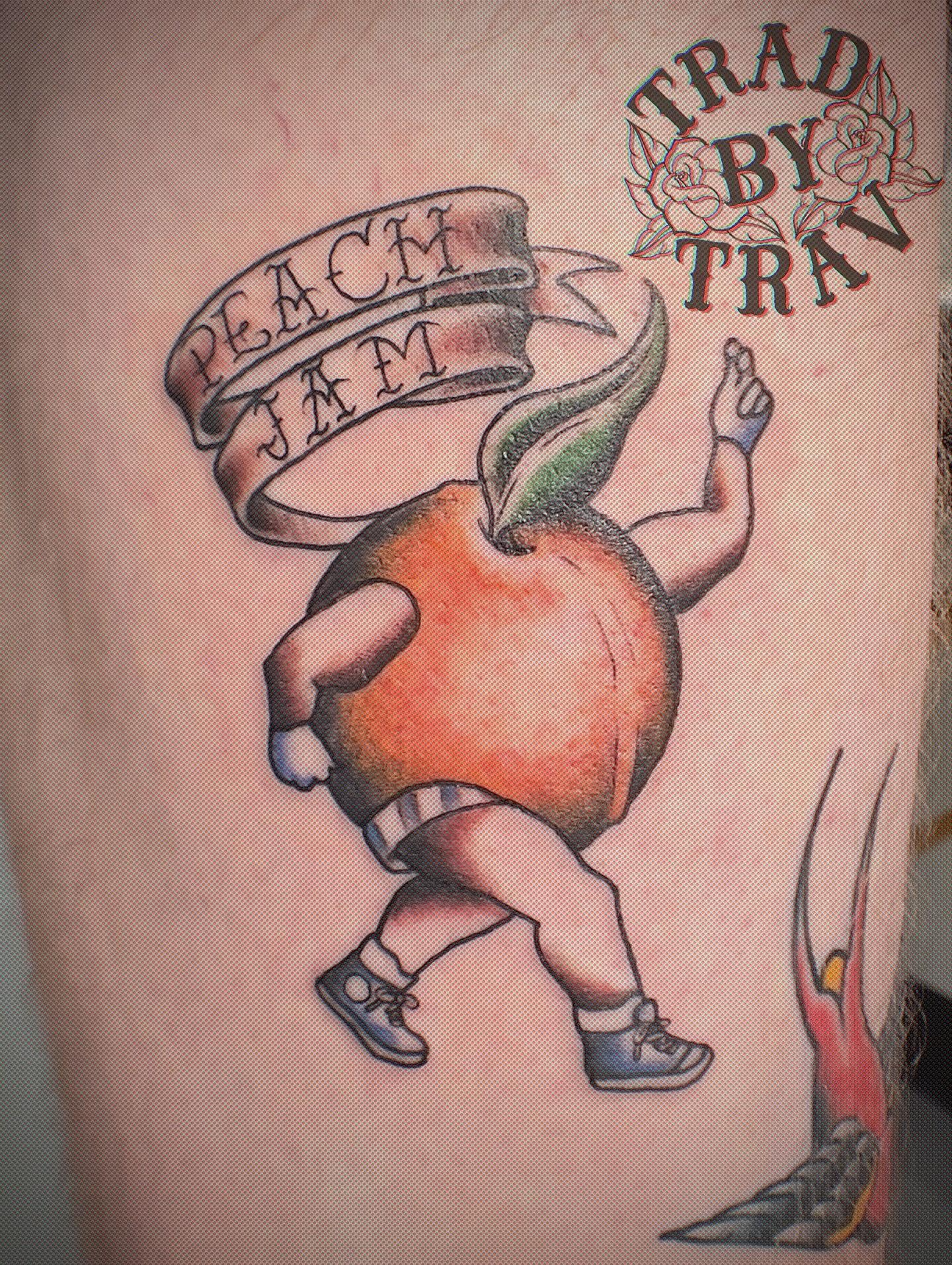 Peach character American traditional tattoo on the thigh by Travis B