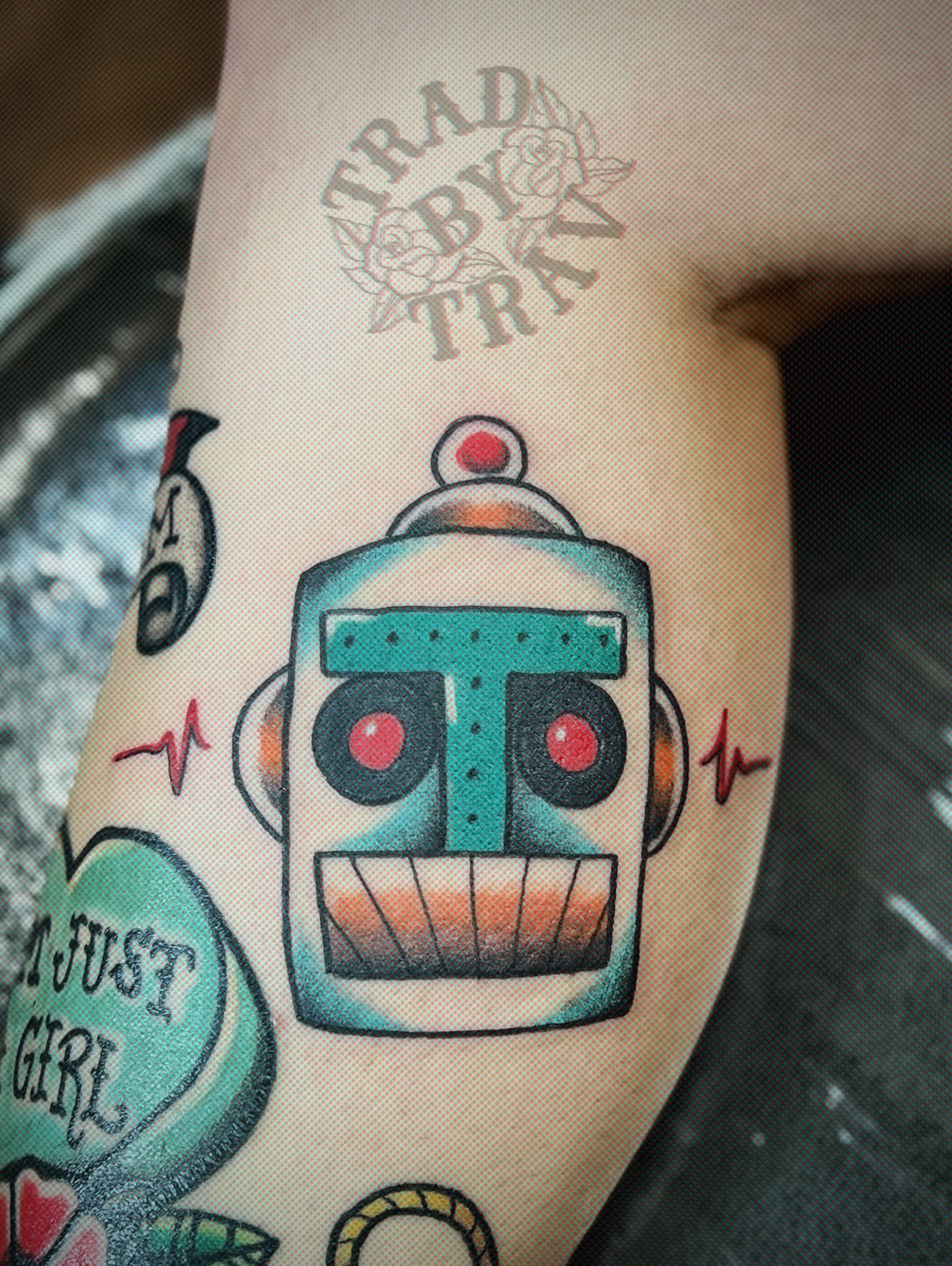 Robot American traditional tattoo on the forearm by Travis B