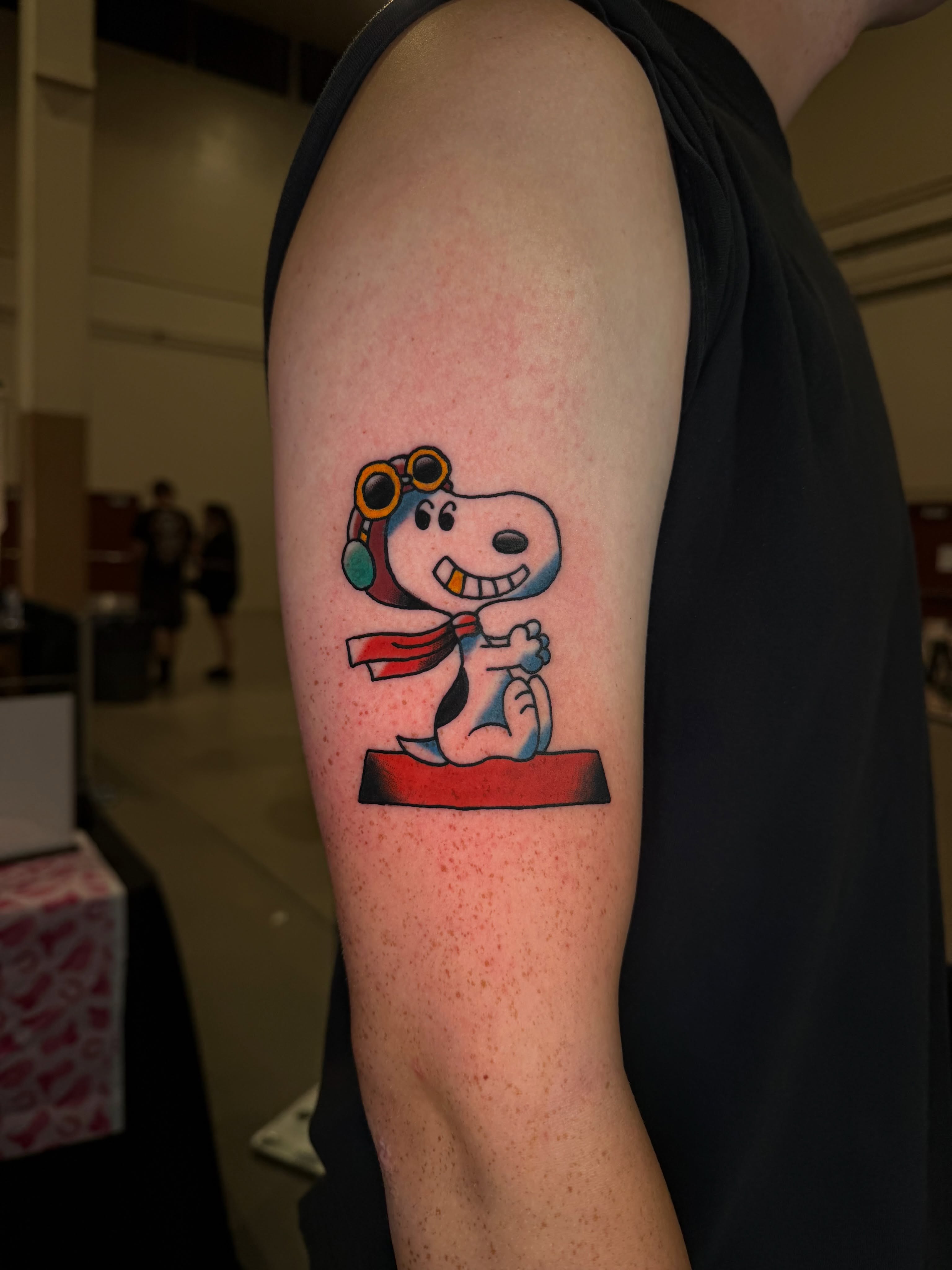 Snoopy illustrative tattoo on the forearm by Dustie Pitstick