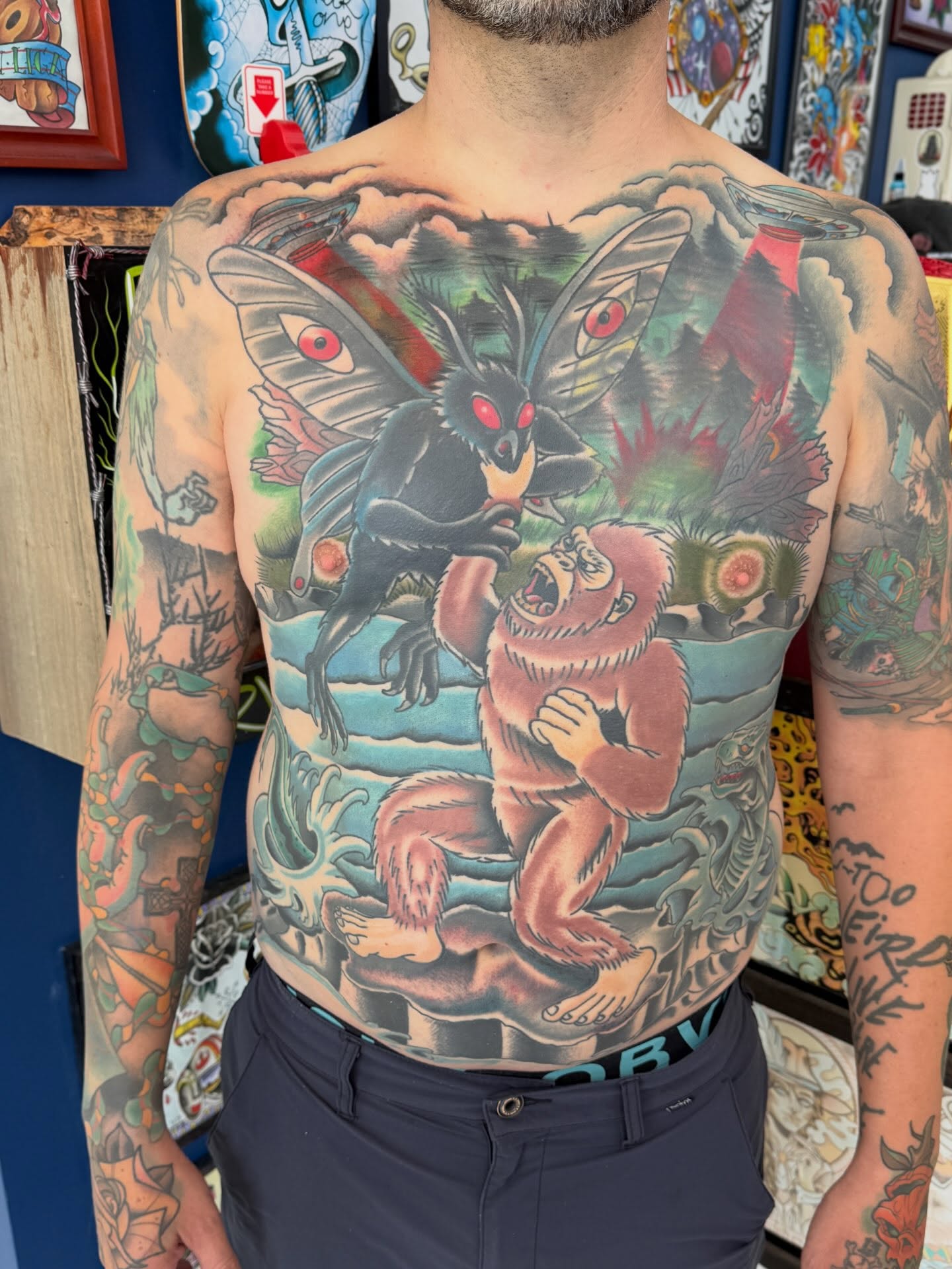 Monster and gorilla American traditional tattoo on the chest by Trent Parsley