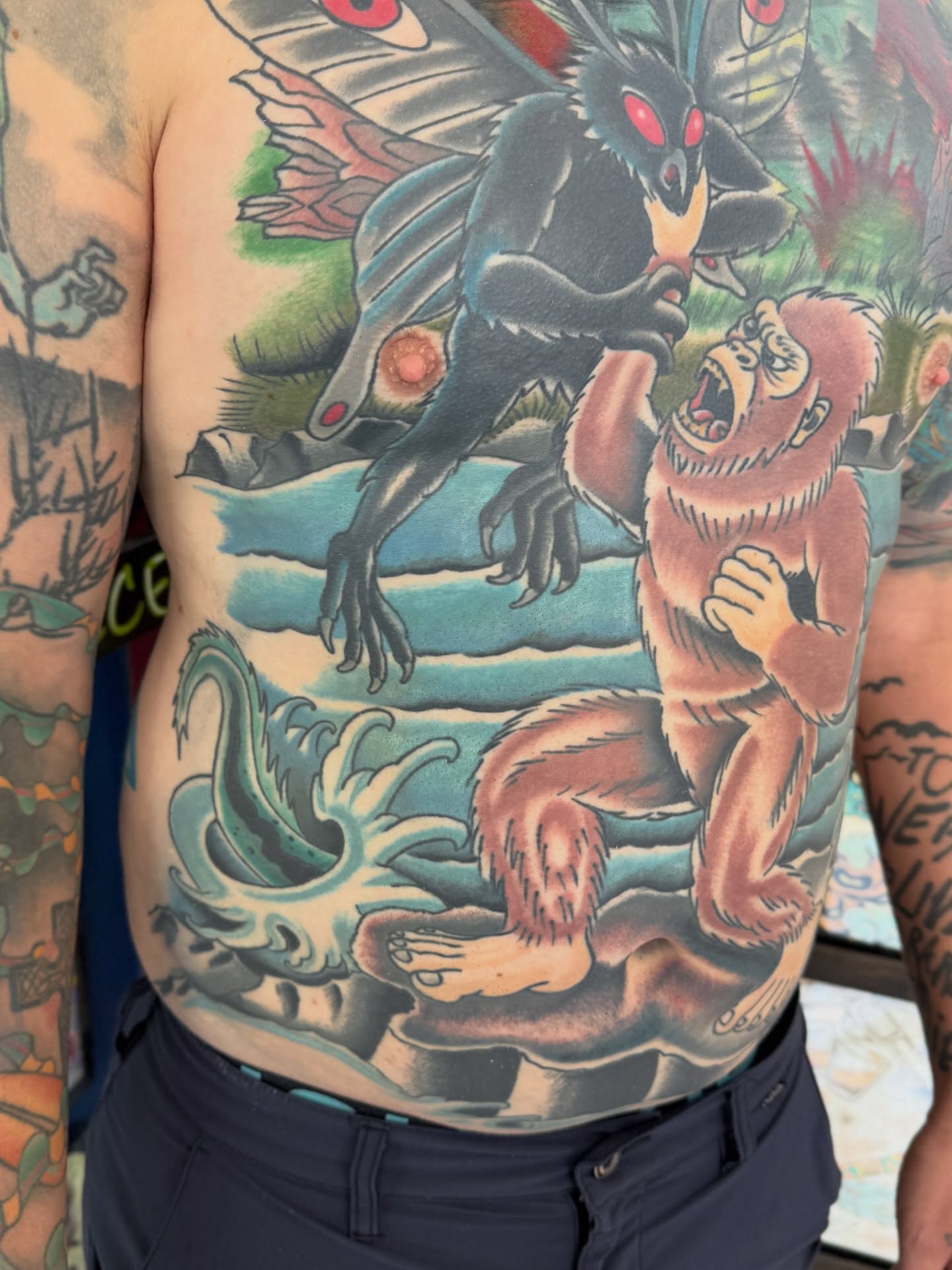 Ape and dragon American traditional tattoo on the torso by Trent Parsley