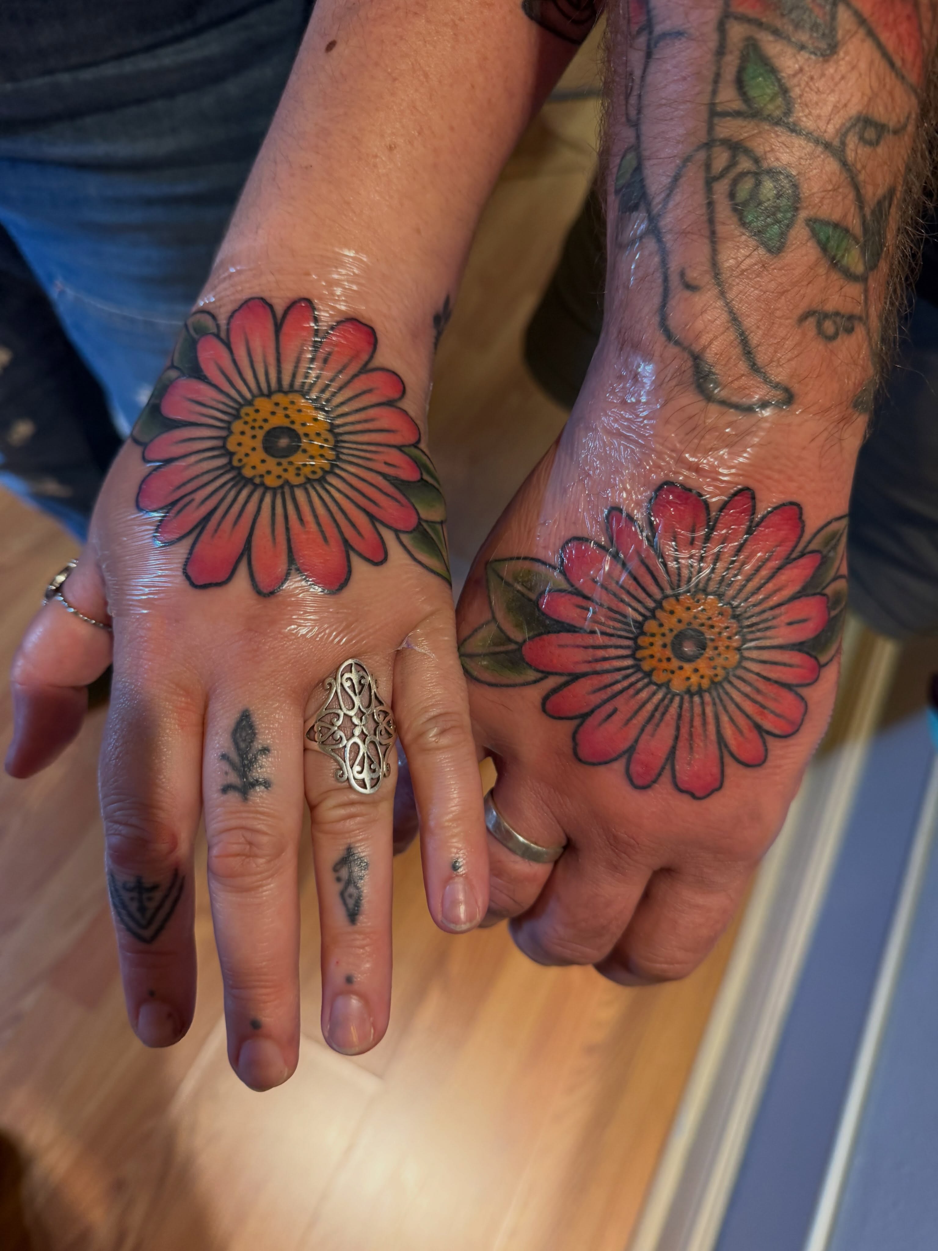 Flower American traditional tattoo on the hand by Beeker, Bellingham, Washington