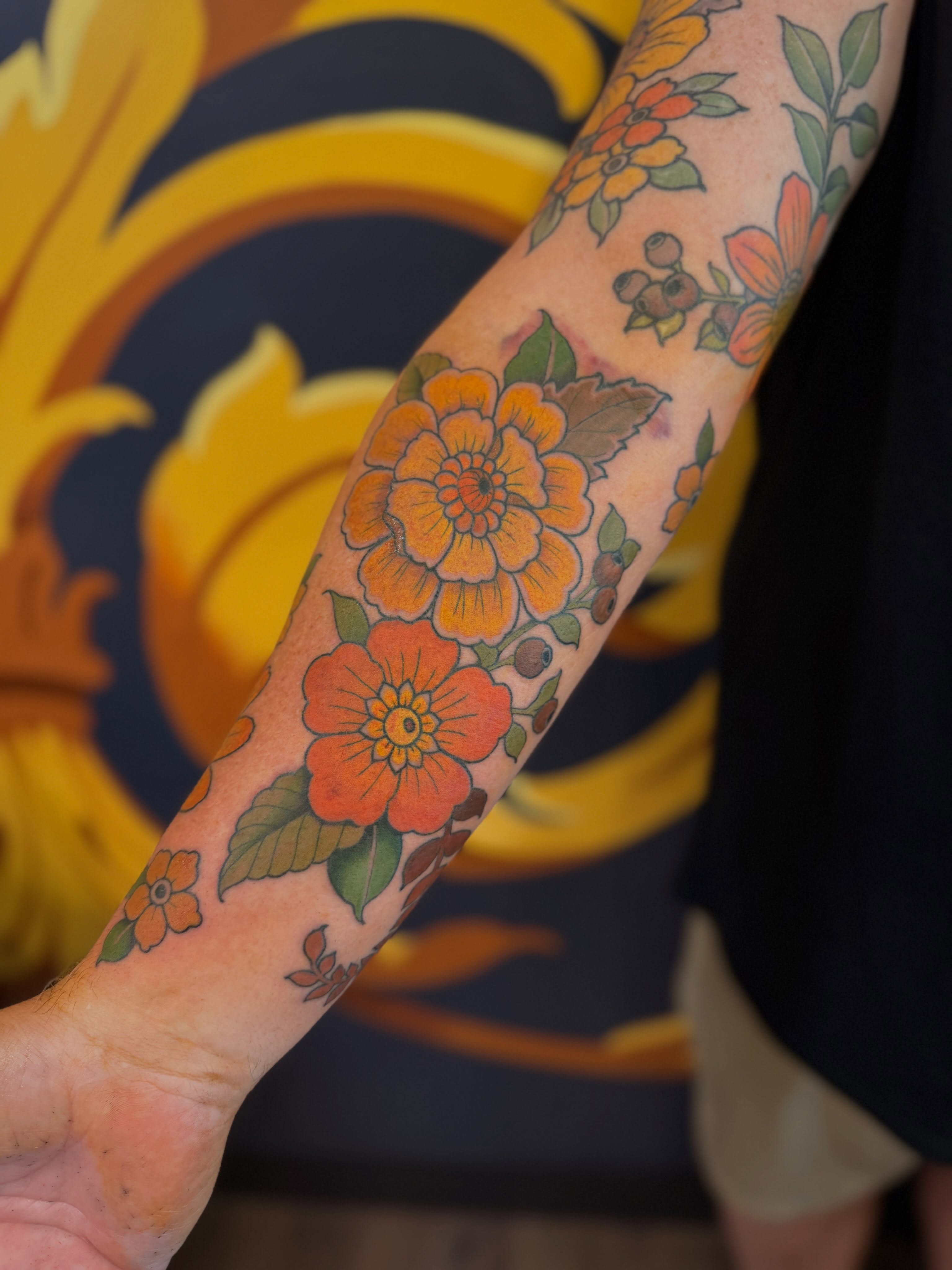 Floral bouquet American traditional tattoo on the forearm by English Cousins, Nashville, Tennessee