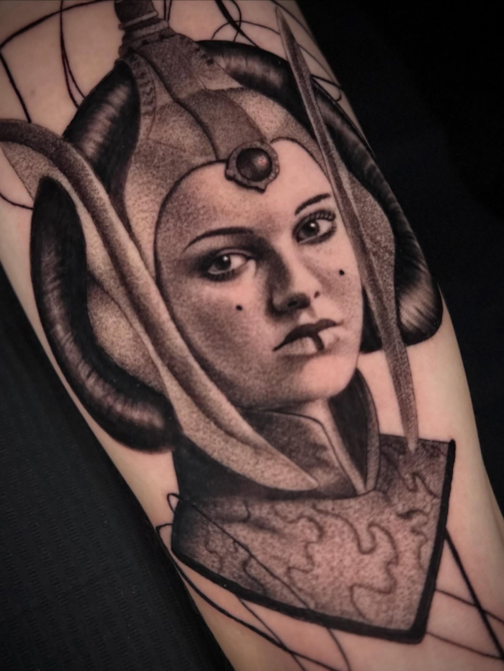 Woman with headdress dotwork tattoo on the shoulder by Terence Taylor